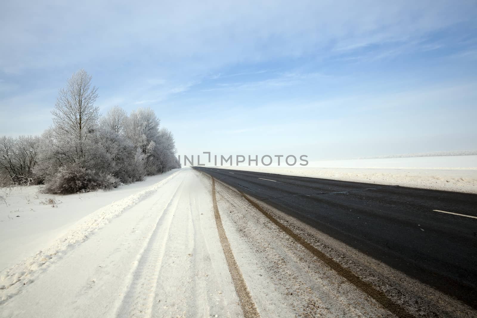   the small asphalted road. winter season