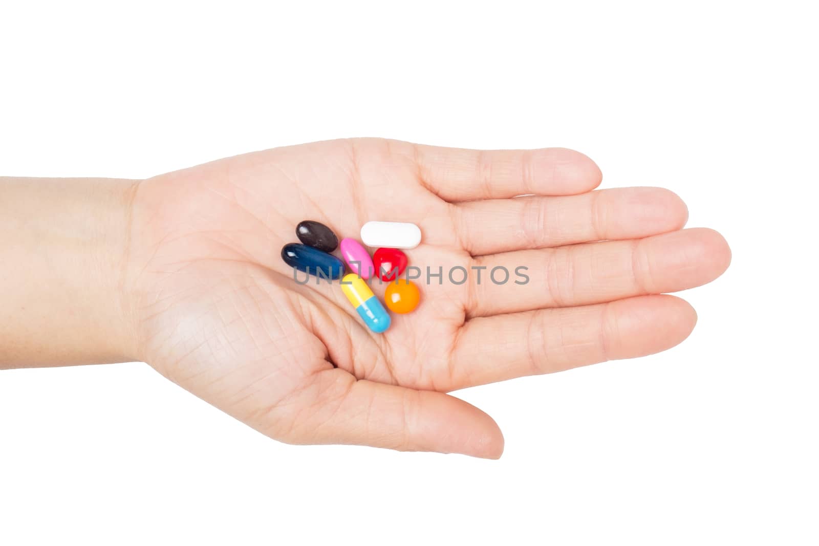 vitamin (medicine) in hand on white background