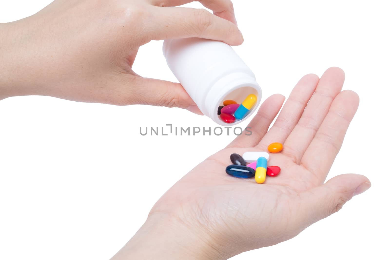vitamin (medicine) in hand on white background