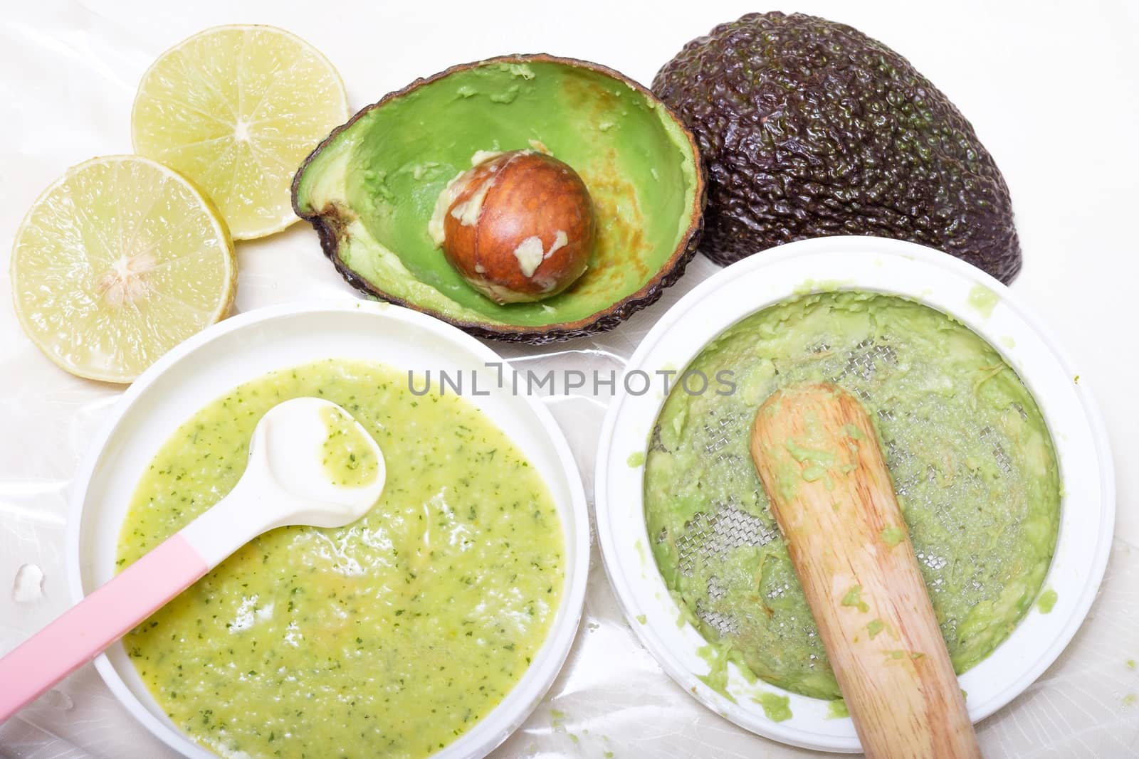 making puree food for baby made by avocado and lemon