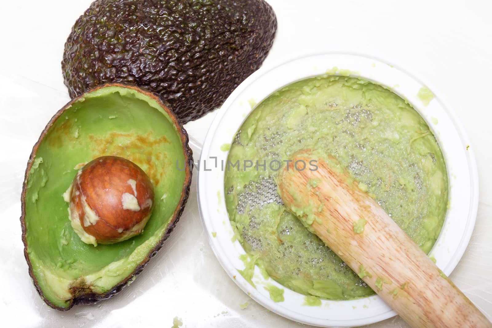 making puree food for baby made by avocado and lemon