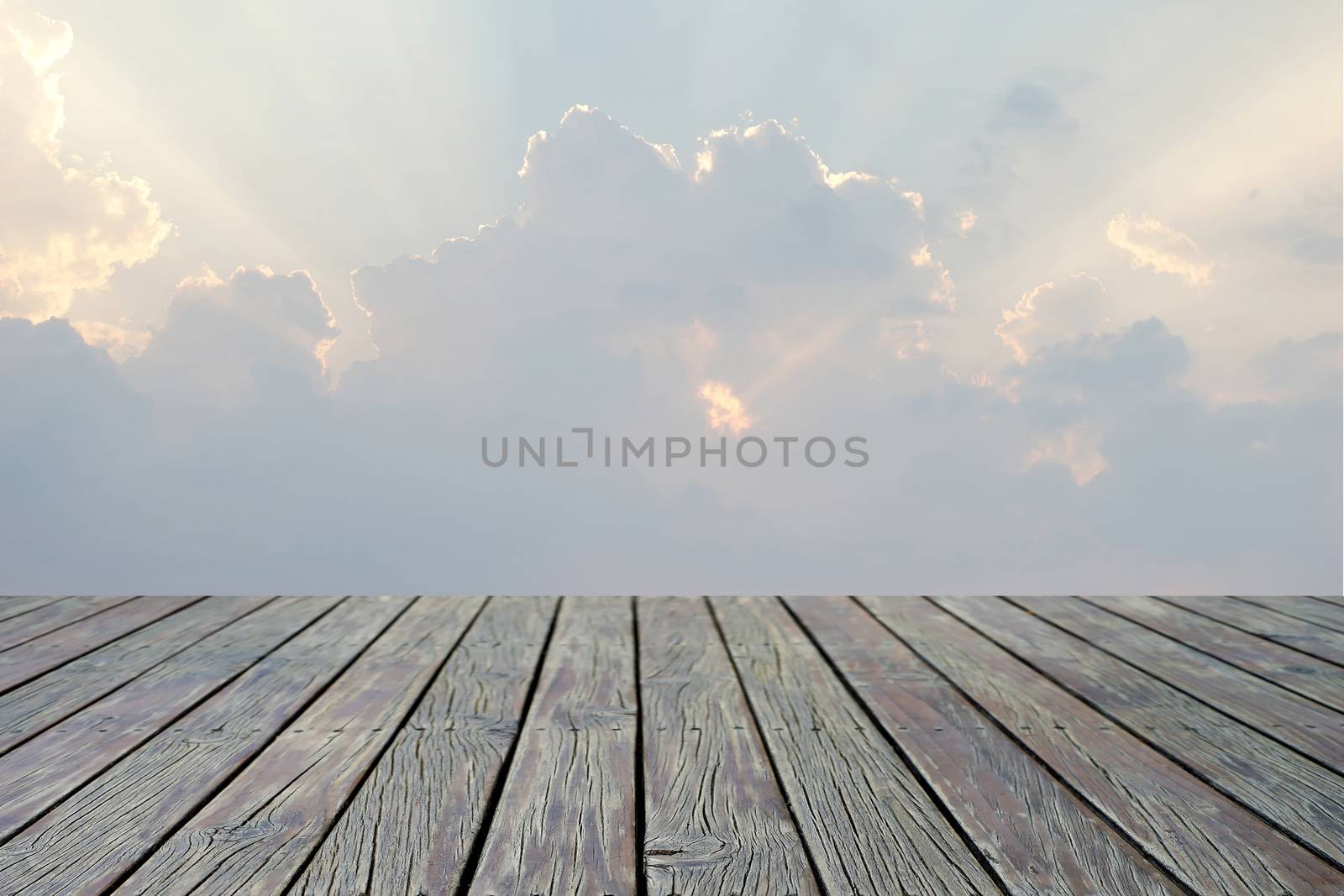 wooden floor with beautiful sunbeam on sky
