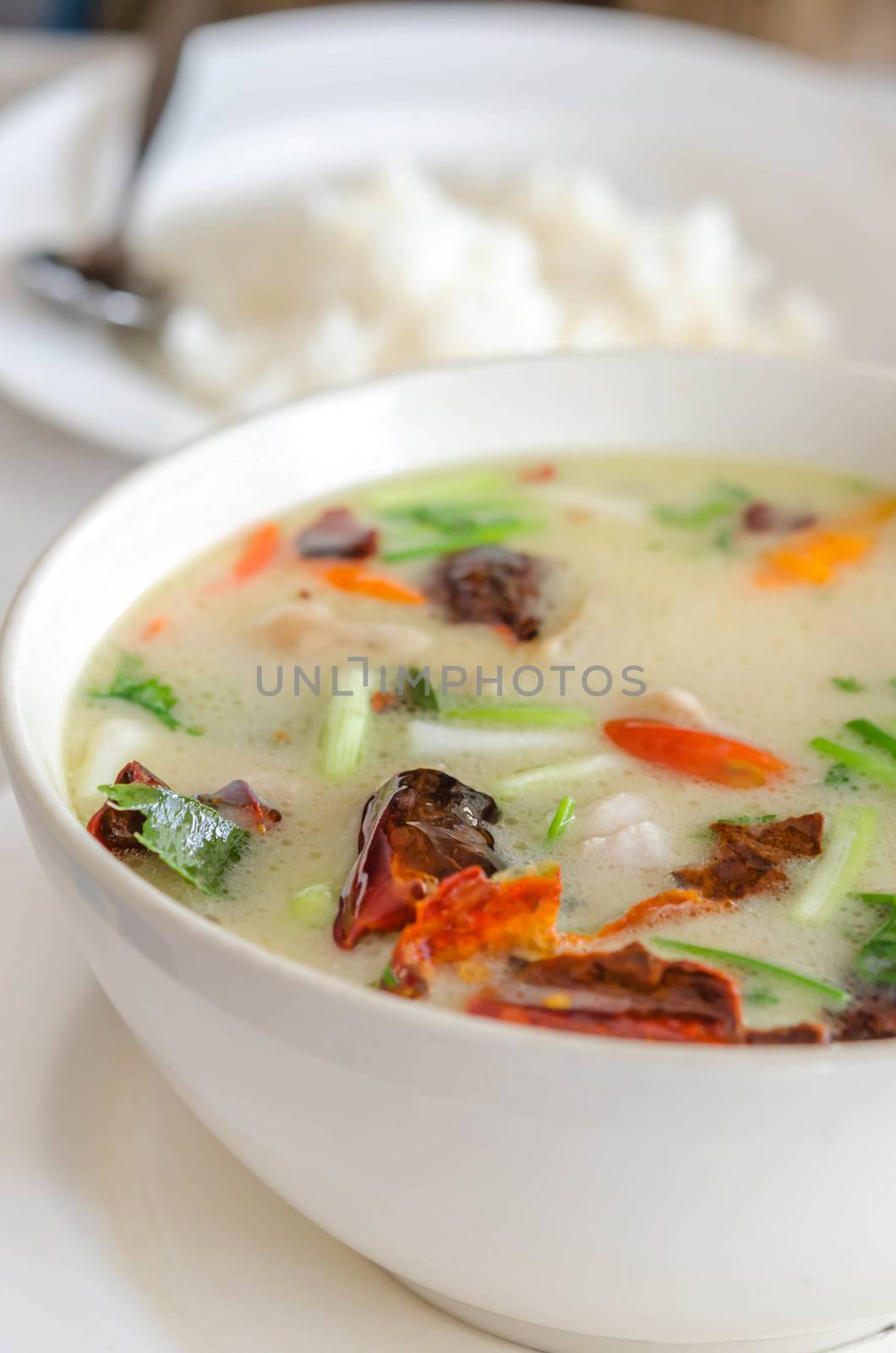 Thai  spicy chicken soup in coconut milk ,mushrooms, intensely flavor of galangal, lemongrass, kaffir lime leaf, cilantro