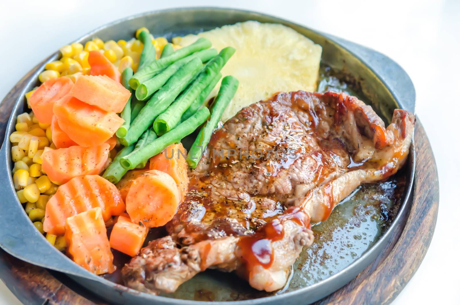 Grilled Steak on Cast Iron Pan with vegetables on the Side