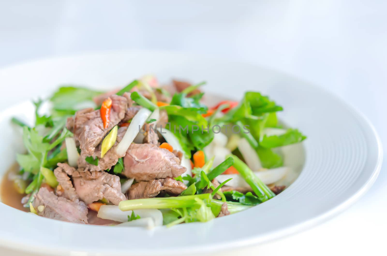 Spicy salad of roasted beef , Thai style cuisine