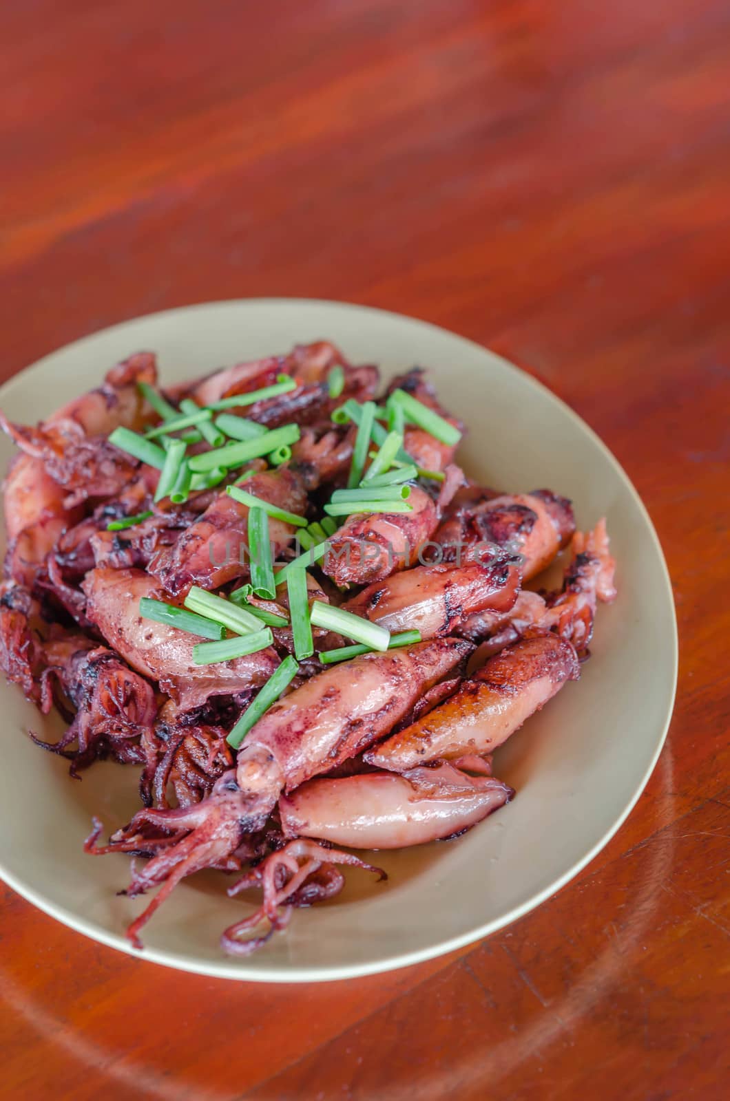 plate of sauteed small squid fried with garlic and sauce
