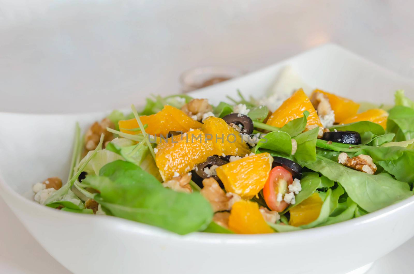 rocket salad with Parmesan cheese and orange fruit