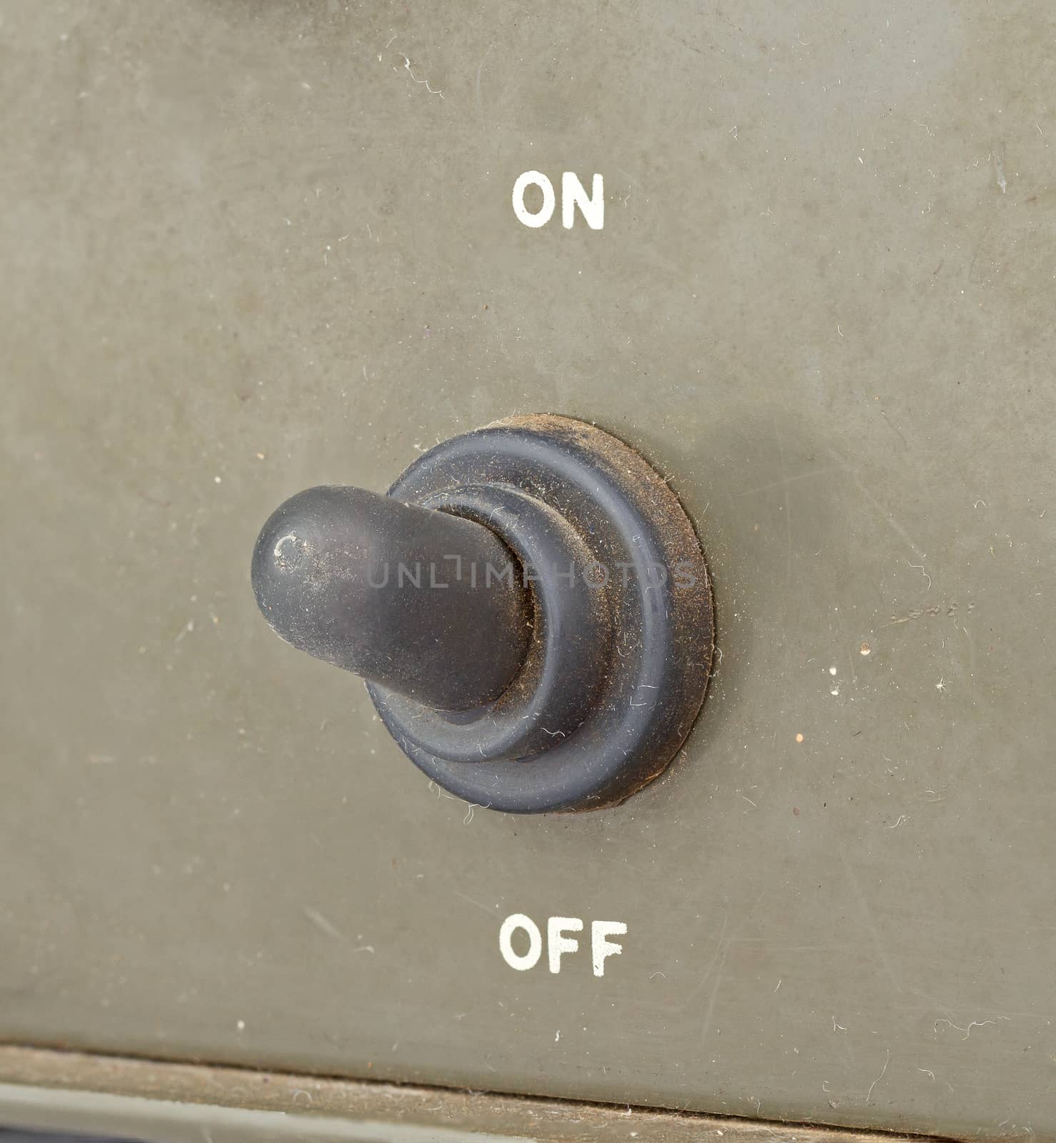 old black toggle switch on green surface - on by supersaiyan