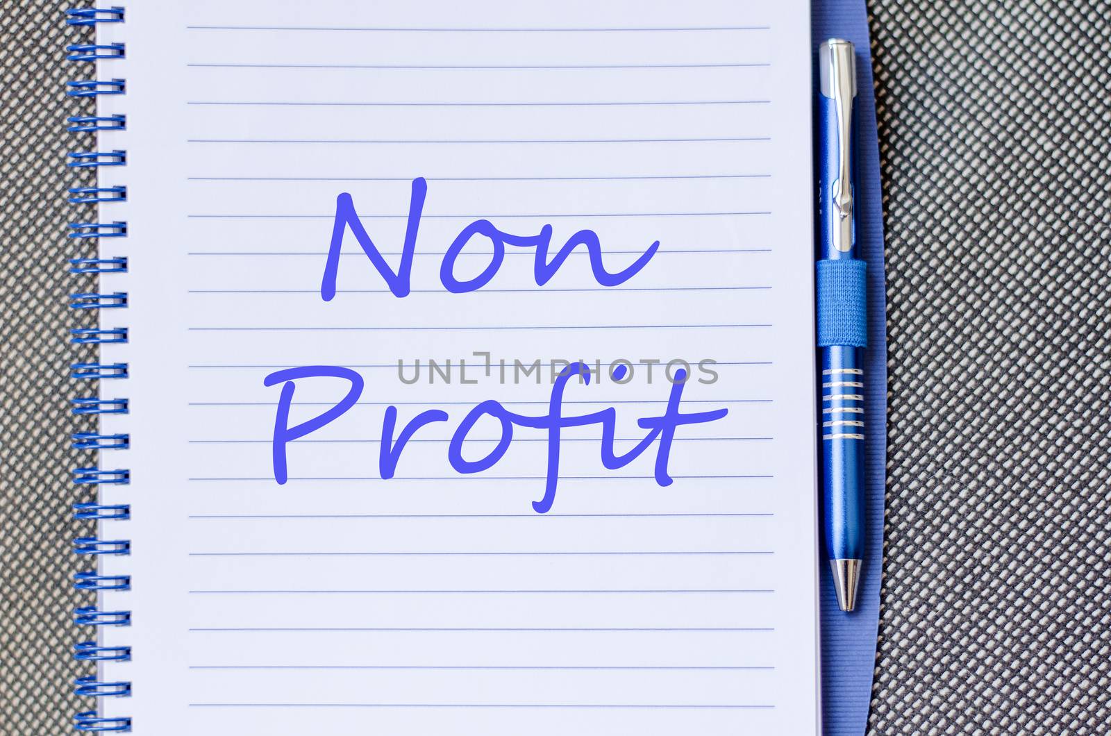 Blue notepad and Non profit text concept
