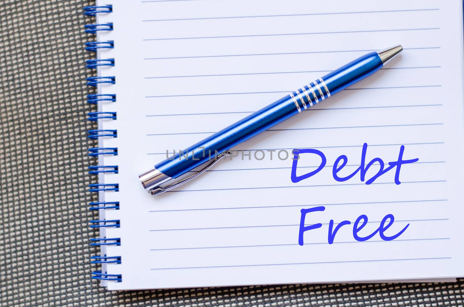 Blue notepad and Debt free text concept
