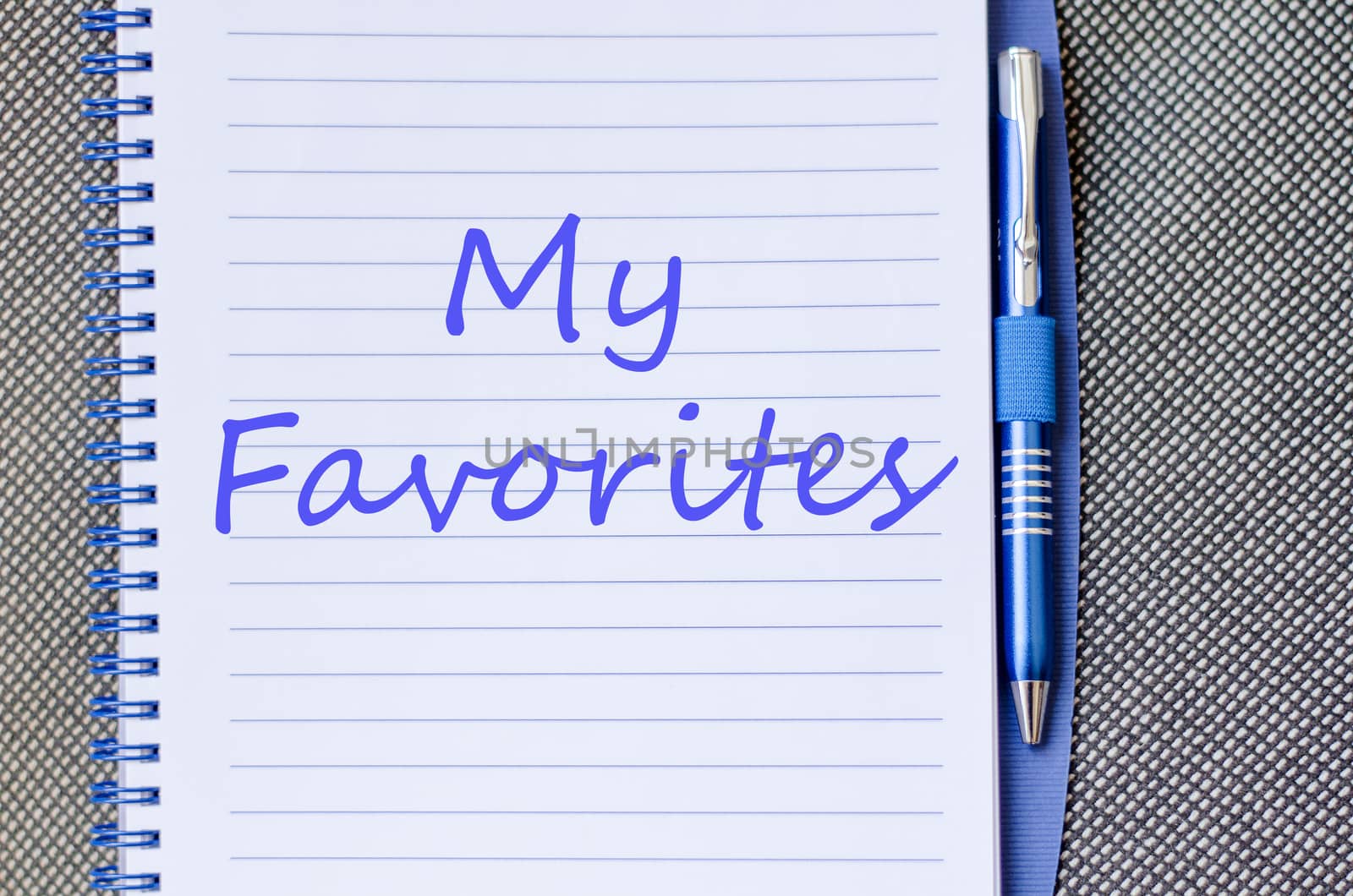 Notepad and pen on wooden background and text concept