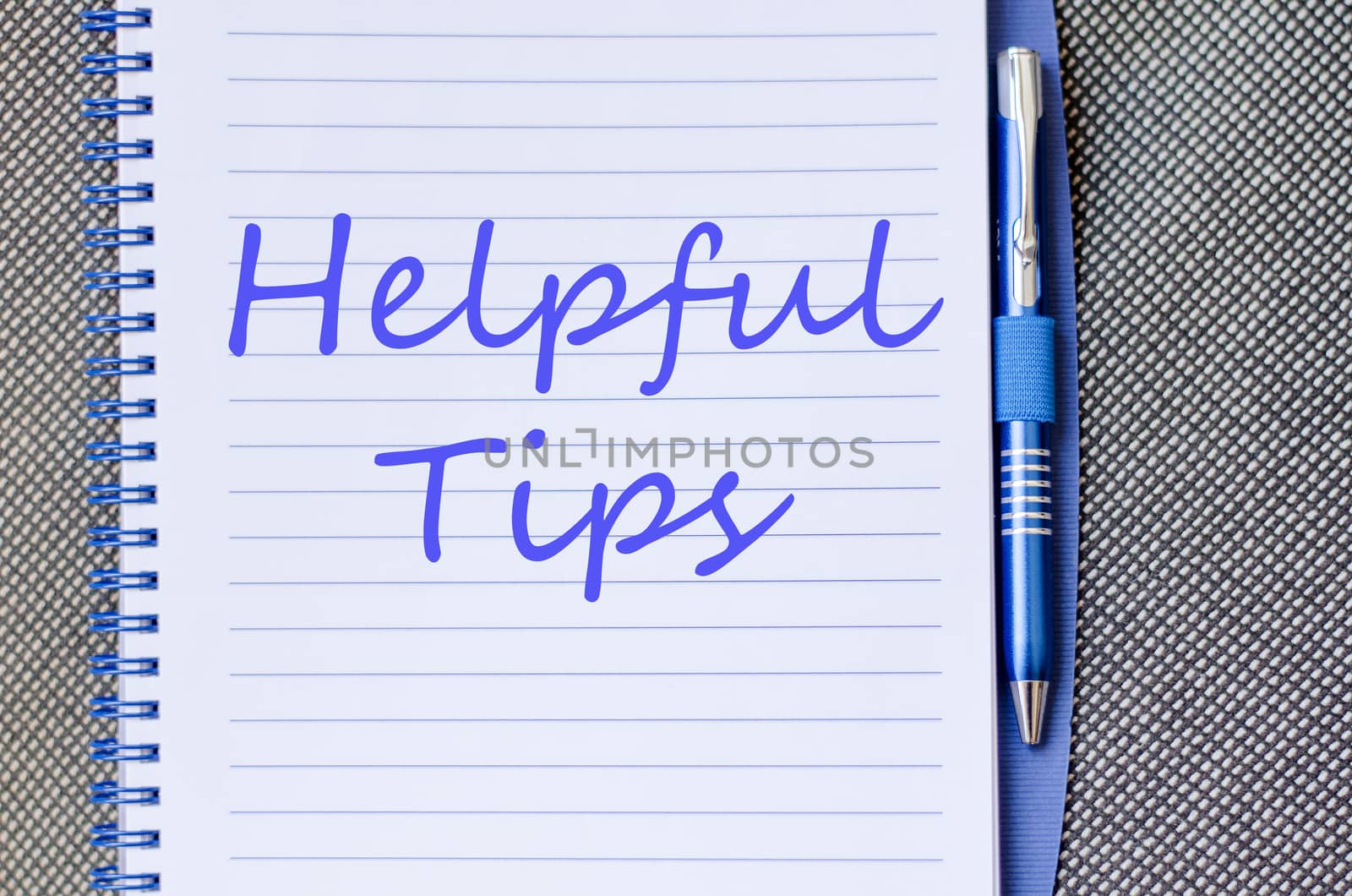 Blue notepad and Helpful tips text concept