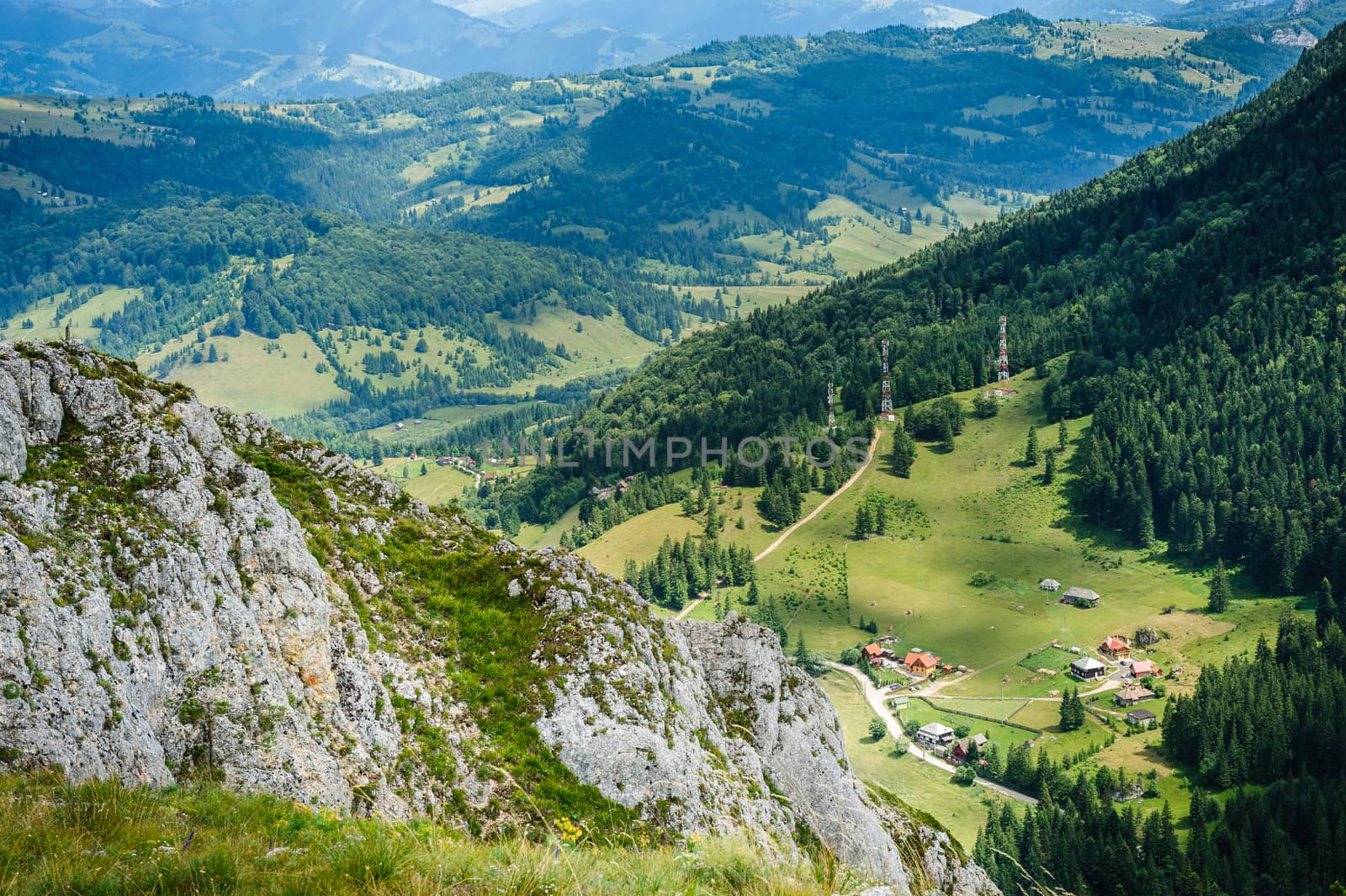 Bird view from Suhardul Mic mountain to populated valley in Red Lake AKA Lacu Rosu area, Carpathians Romania.