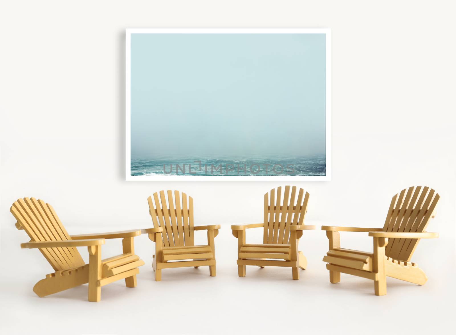 Four miniature adirondack chairs on white background