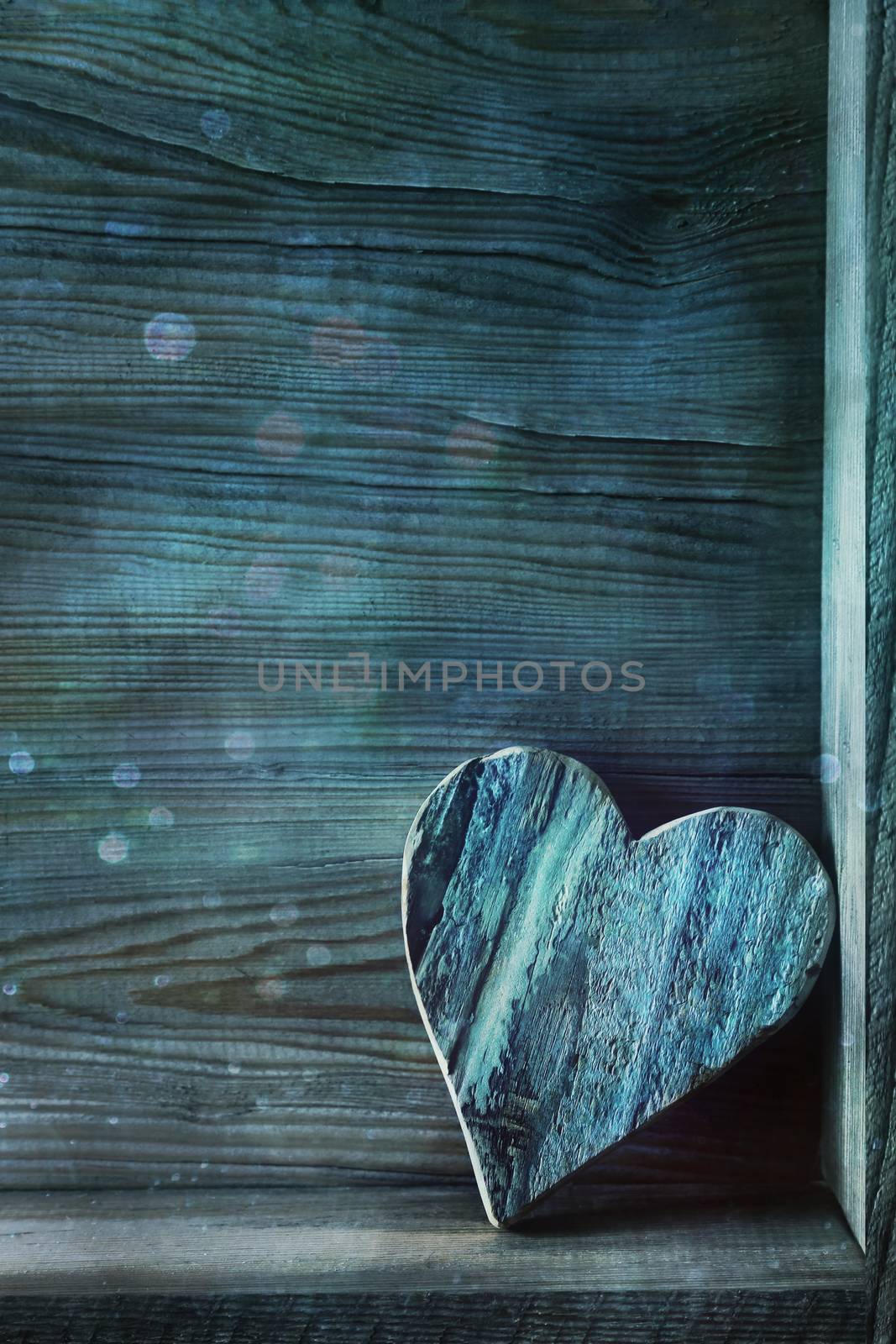 Blue wooden heart on wood by Sandralise