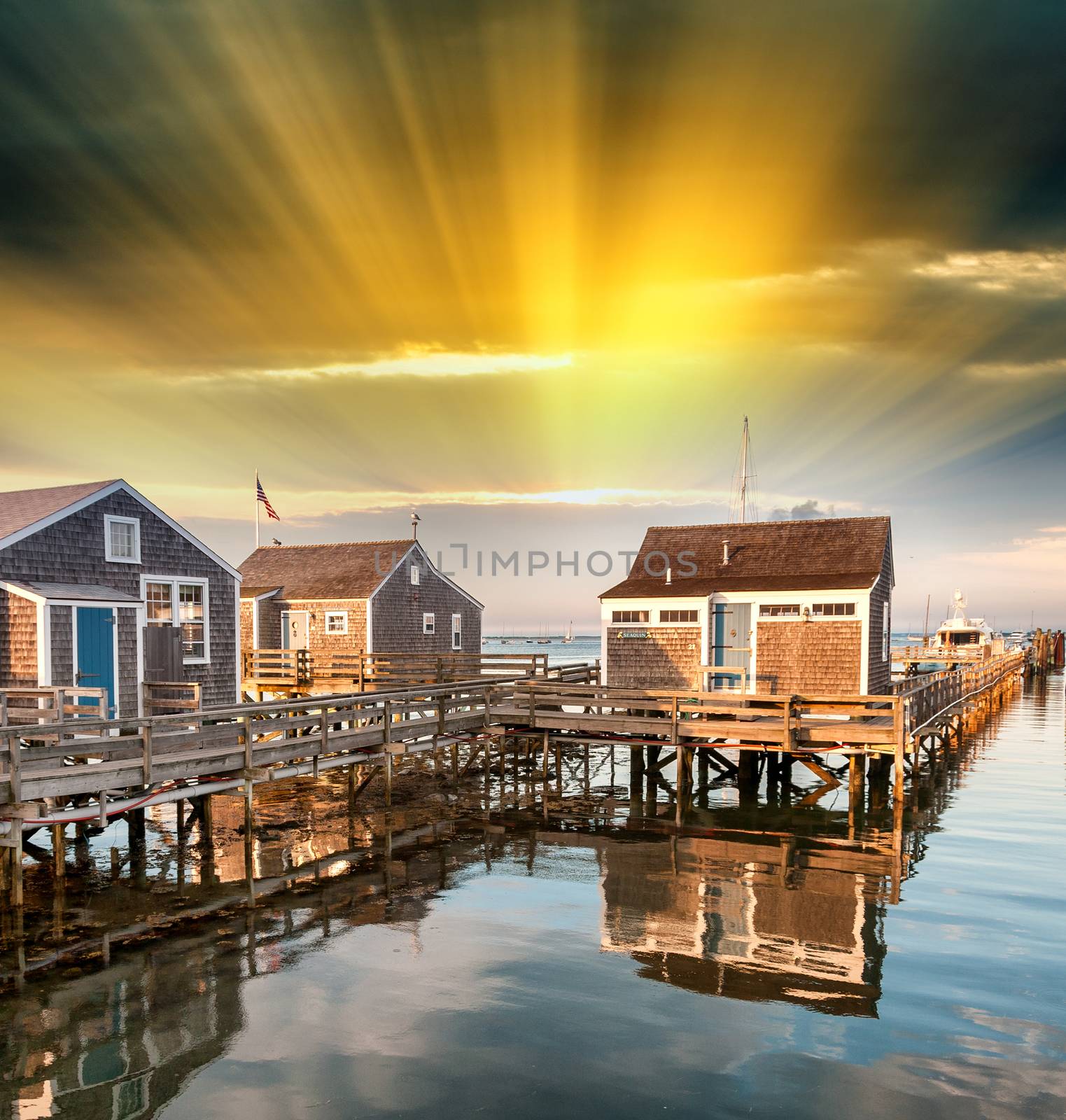 Beautiful homes of Nantucket, Massachusetts. Houses over water at dusk.