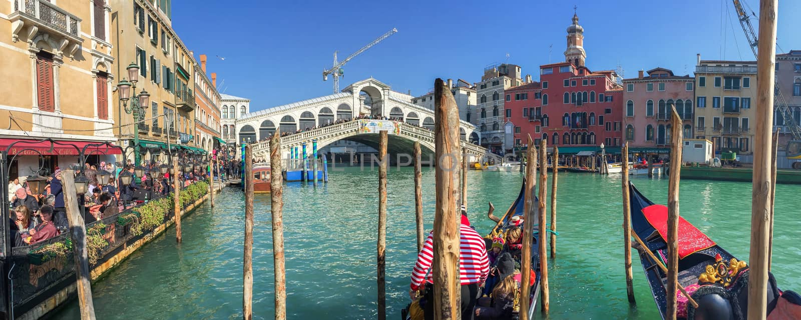 VENICE - FEBRUARY 8, 2015: Tourists along city canals. Venice at by jovannig