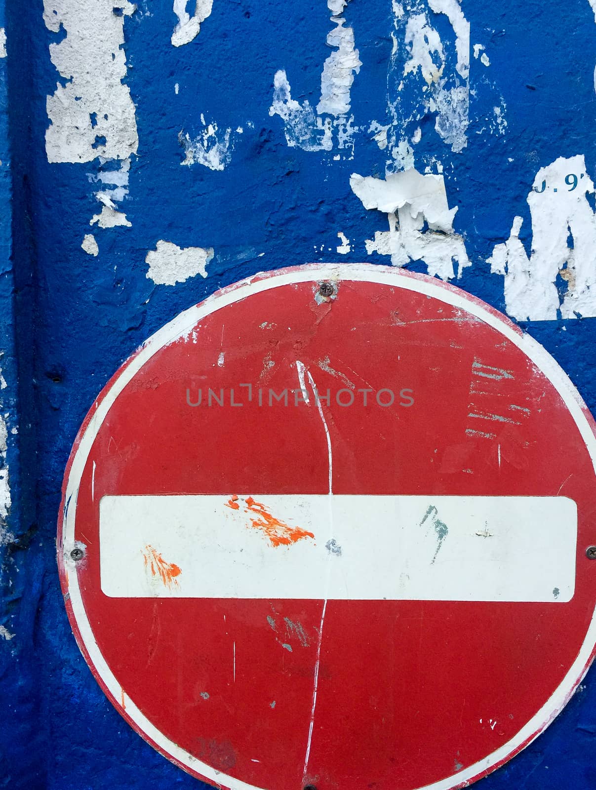 No entry sign on blue background wall by jovannig