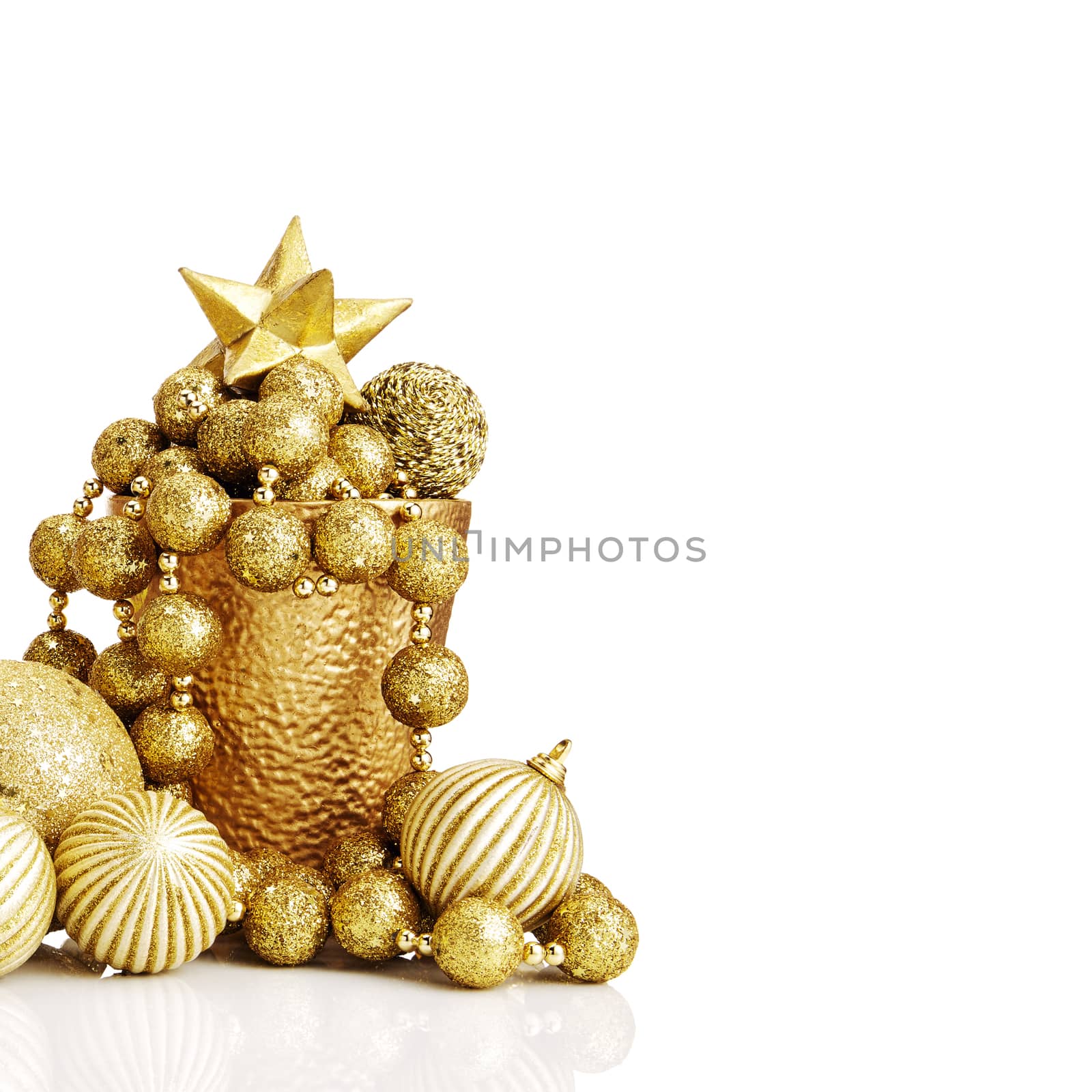 Composition of gold Christmas decorations on white background.