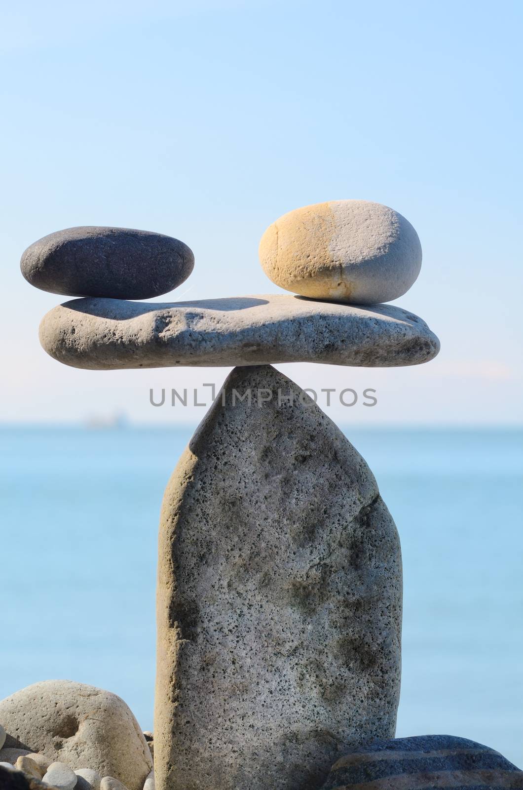 Symbol of scales is made of pebbles on the seashore