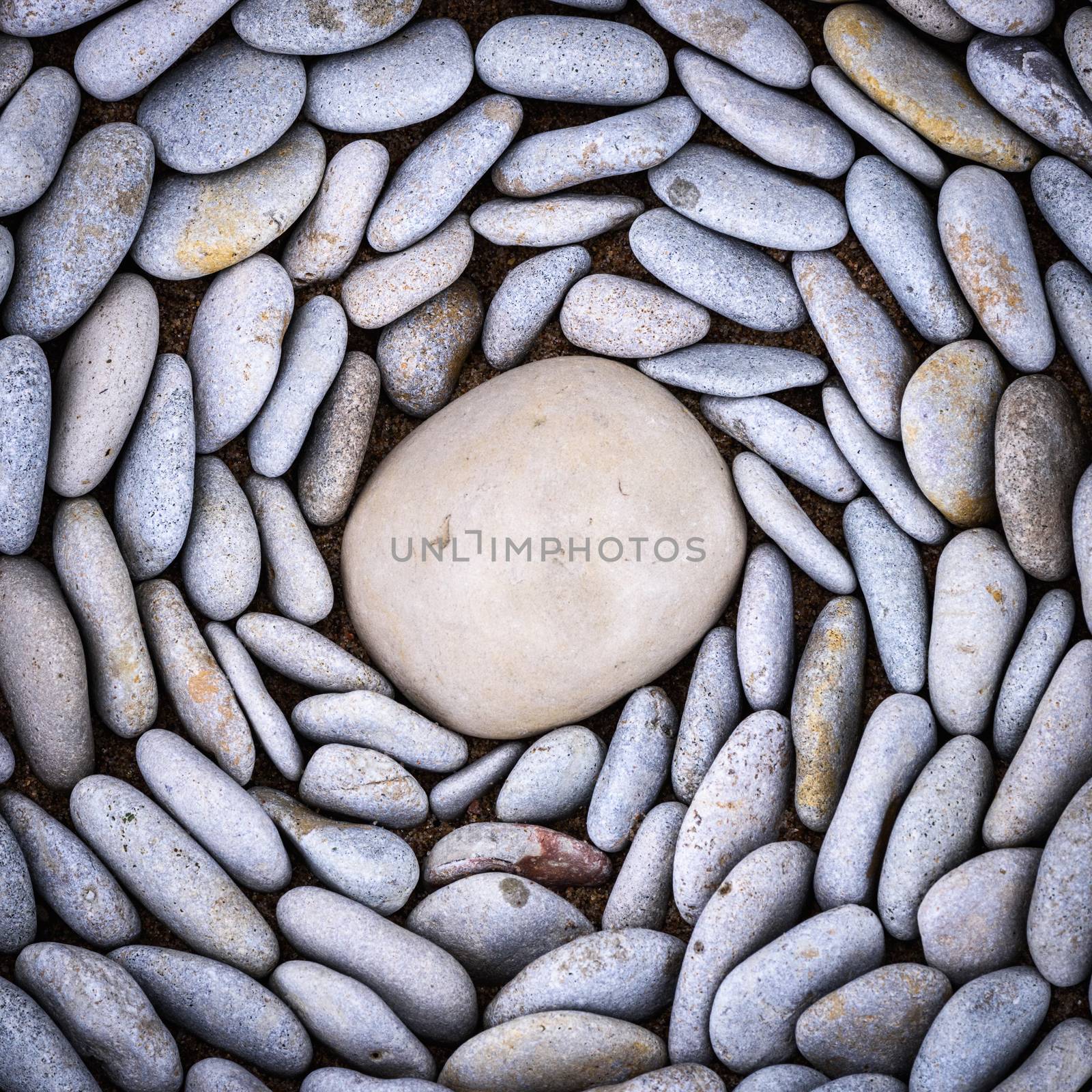 Lot of pebbles around big stone