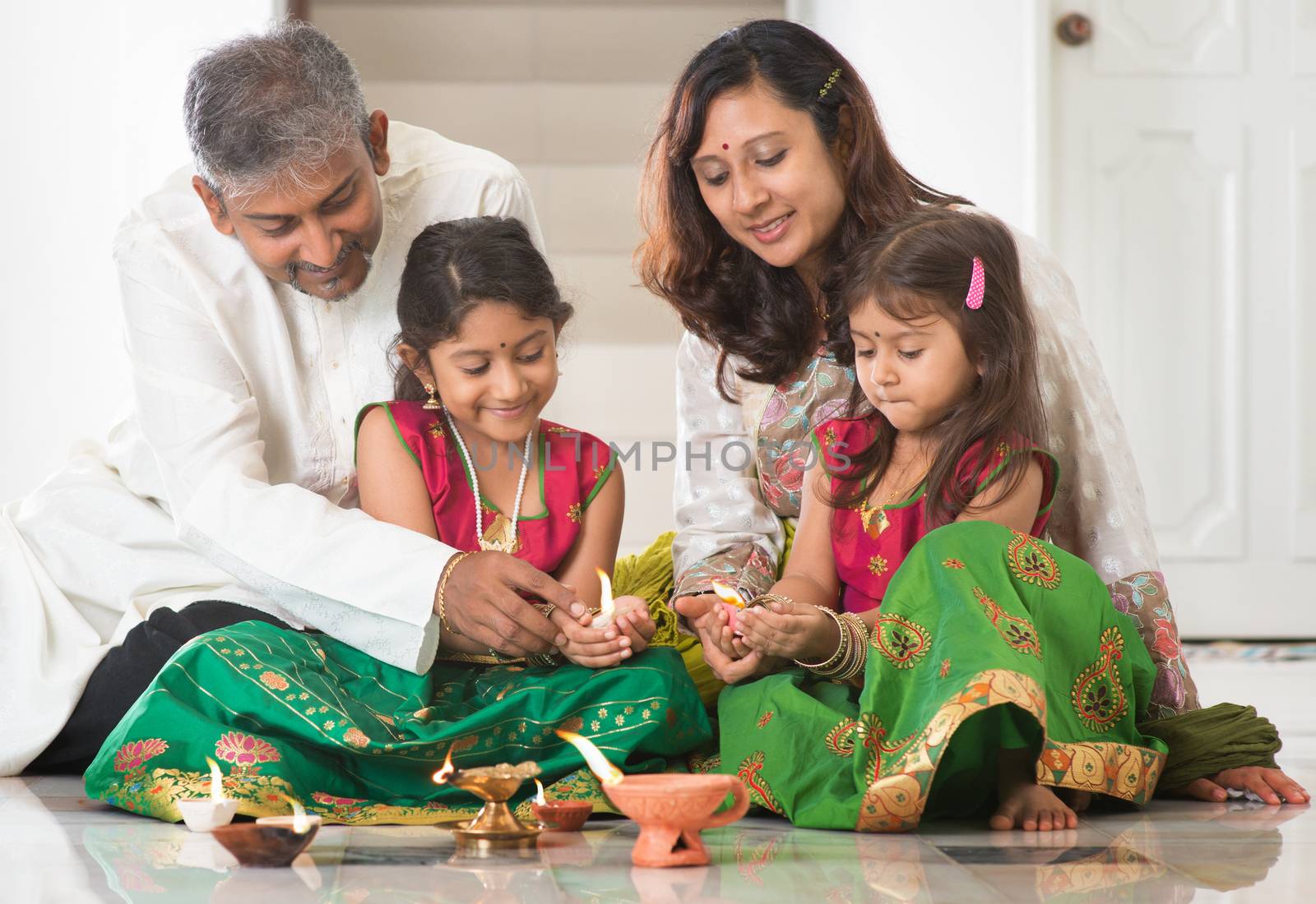 Indian family celebrating Diwali by szefei