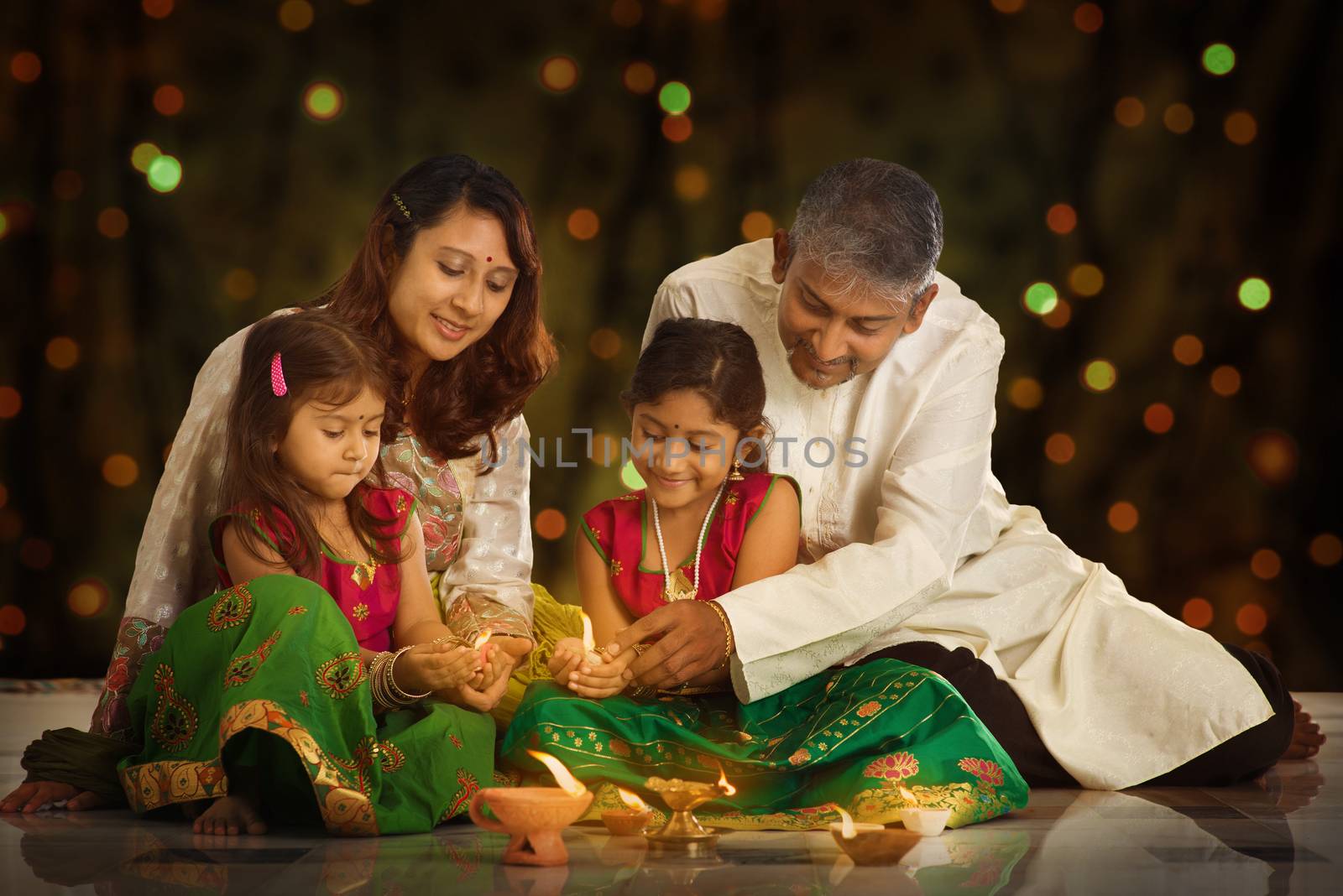 Indian family celebrating Diwali, fesitval of lights by szefei