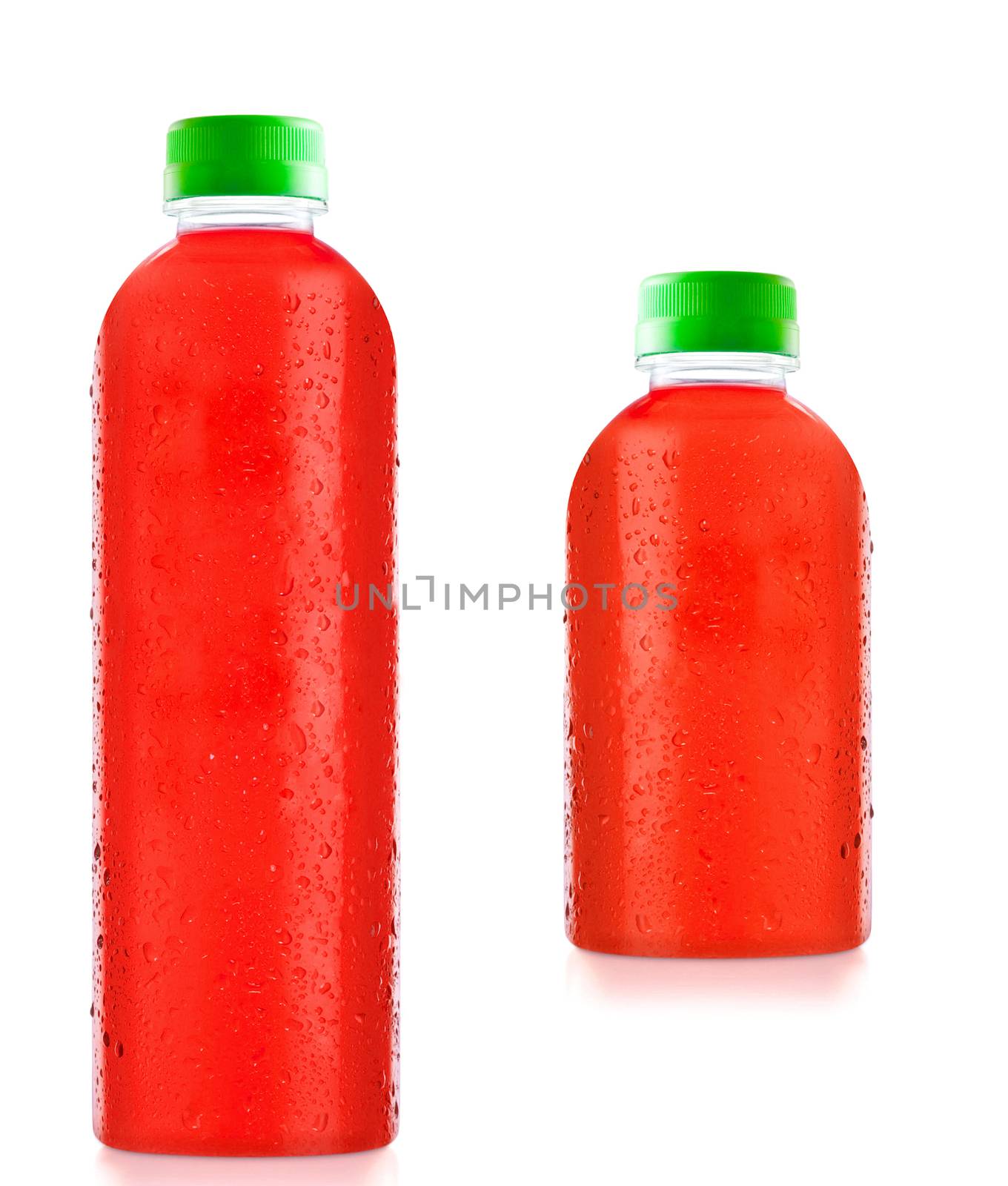 bottles fruit juice with drops of water isolated by ozaiachin