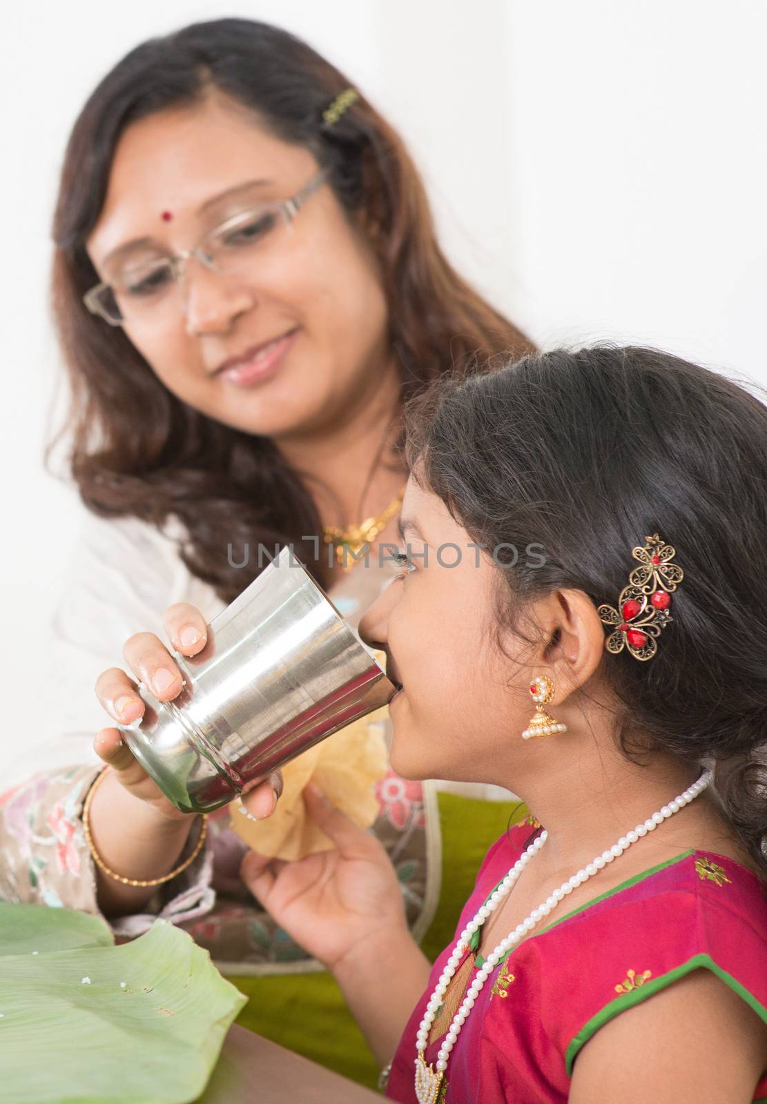 Indian girl drinking water by szefei