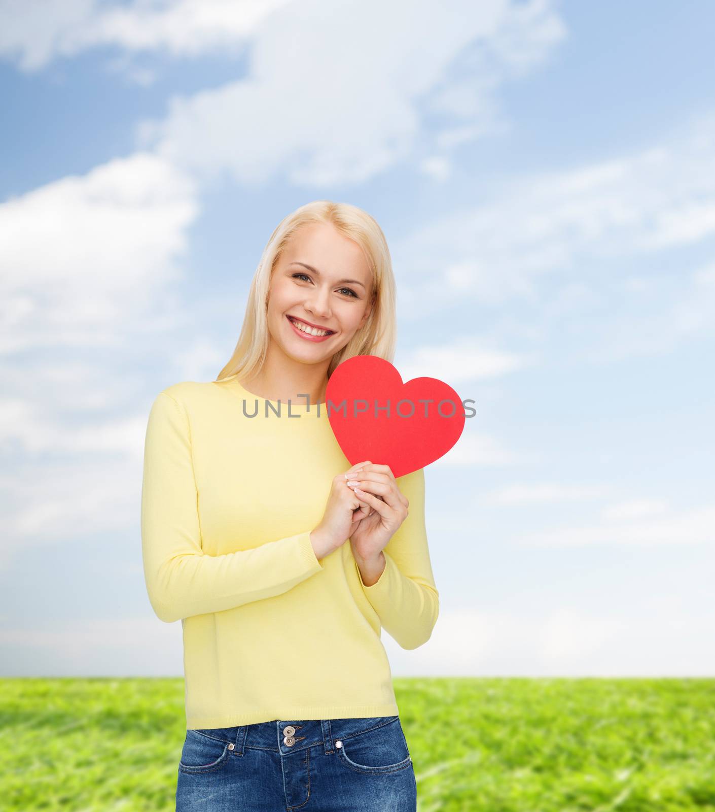 smiling woman with red heart by dolgachov