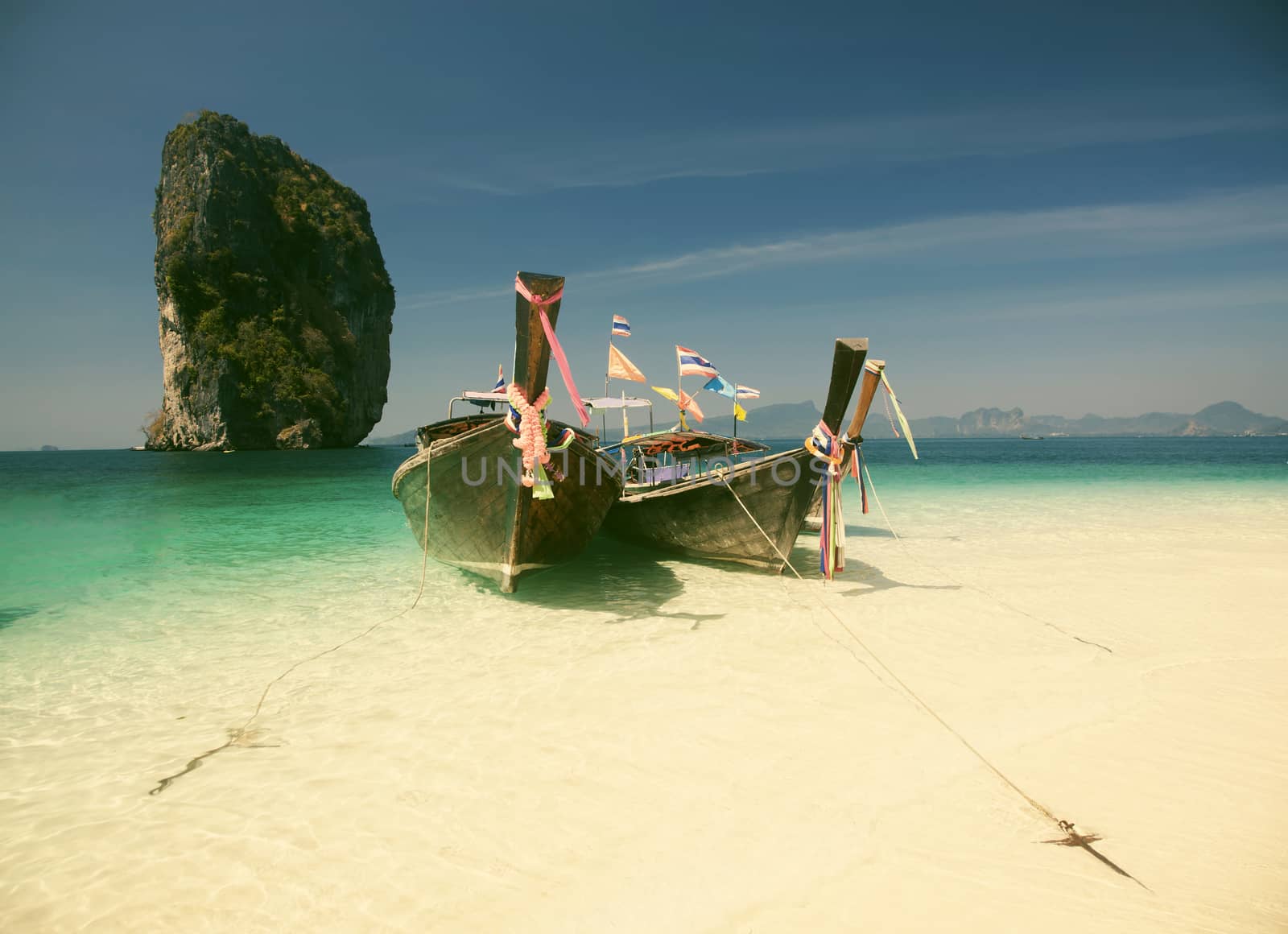 Thailand beach on tropical island. Beautiful travel background of Asia coast 