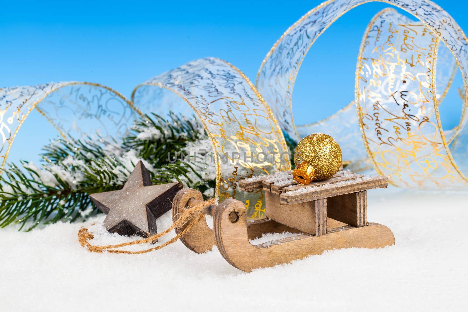 Christmas decoration over snow, blue background by motorolka