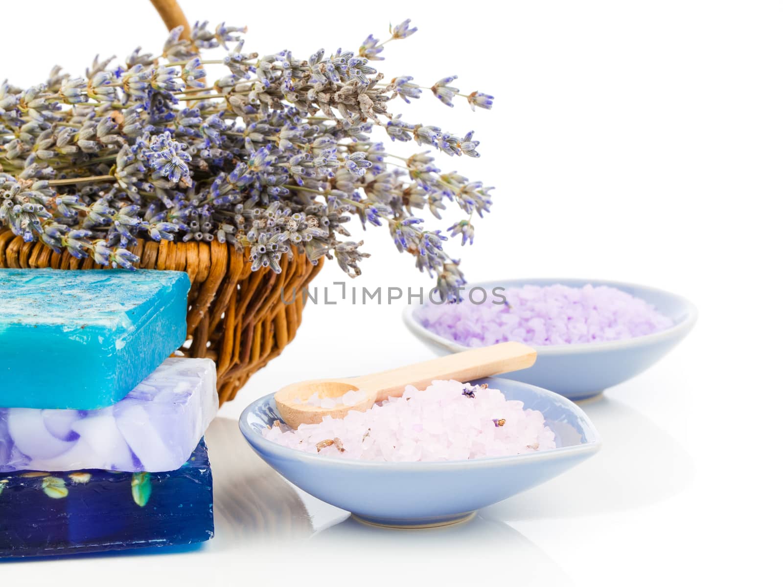 Spa still life with lavender flowers and bath salt, on white background