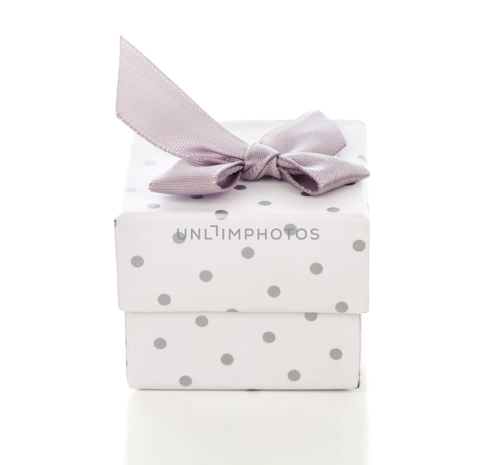 gift box present with satin bow isolated on white by motorolka