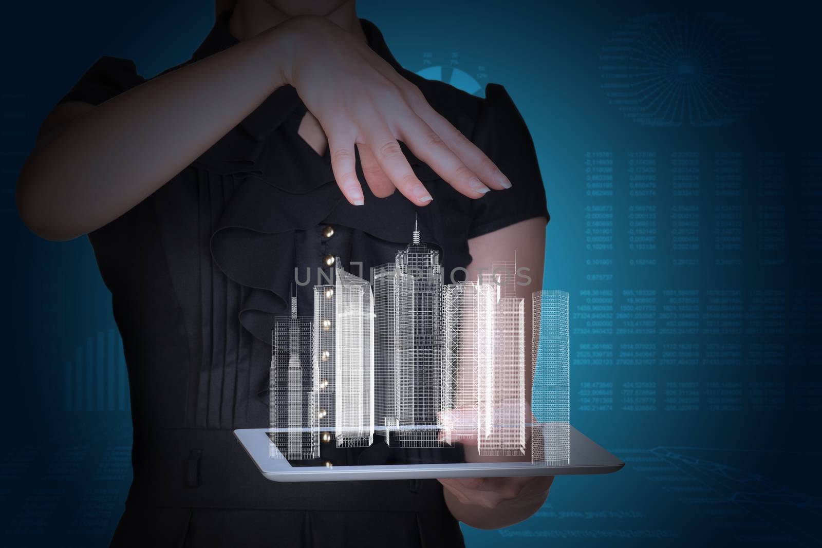 Businesswoman with tablet and 3d city model on abstract blue background