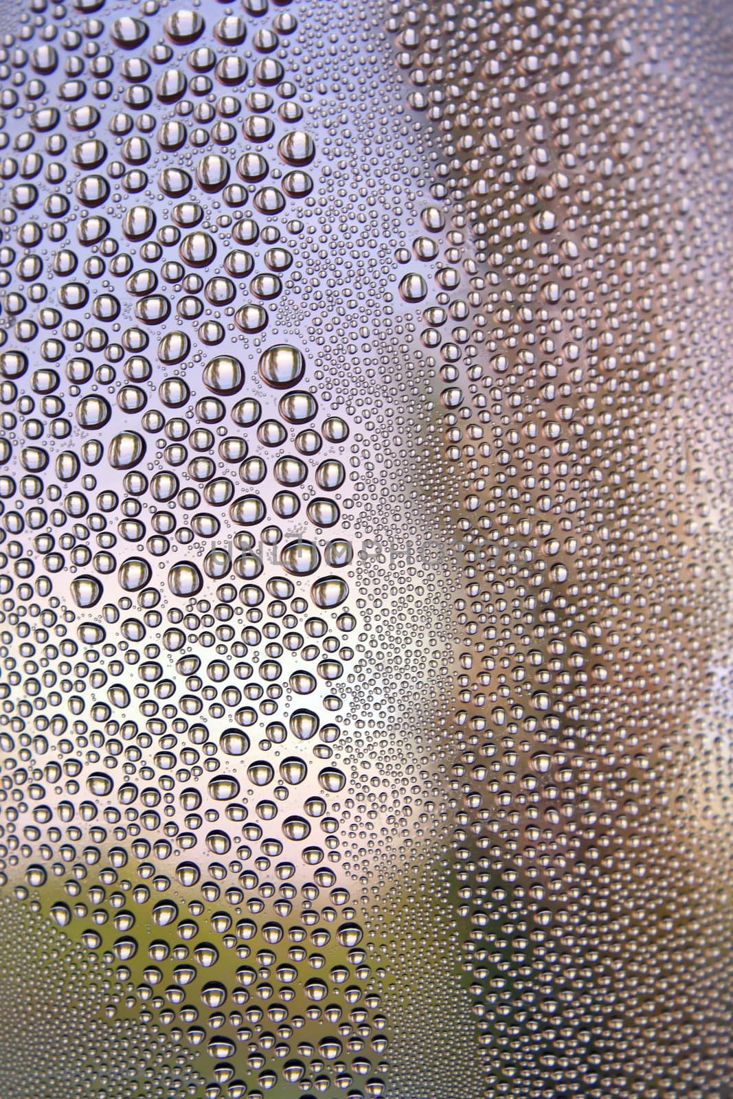 Drops of water on the crooked glass, shallow dof