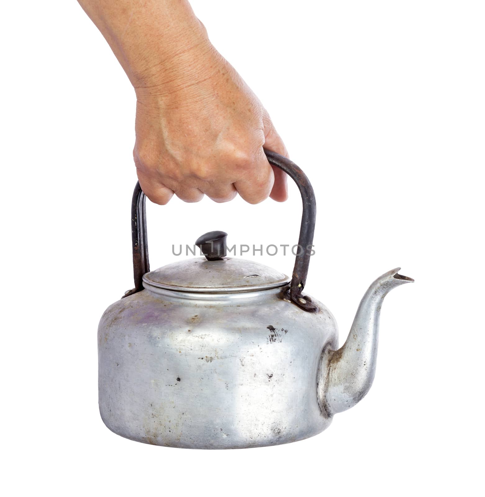 old dirty classic aluminum kettle holding in hand isolated on white background