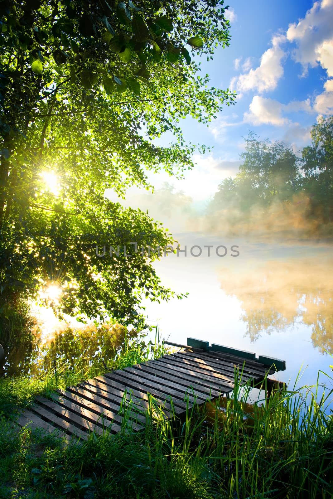 Fishing pier on river by Givaga