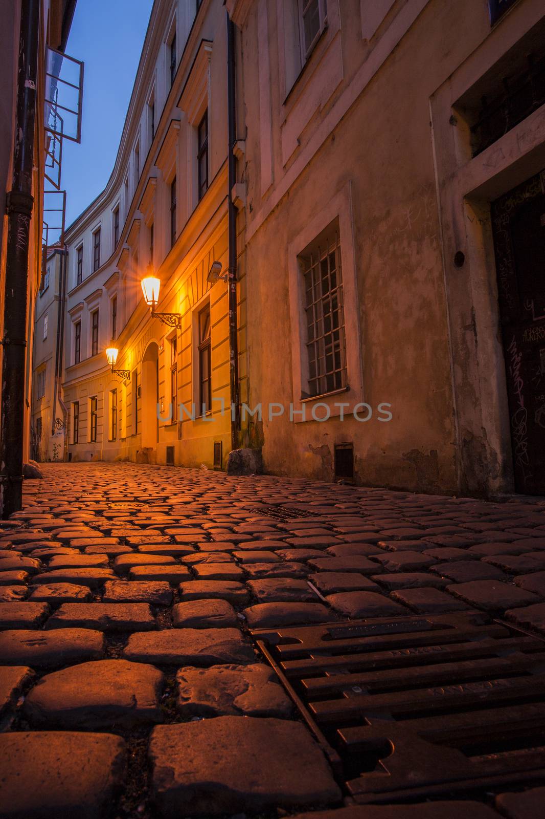 Prague street at night with sewer by A-dam