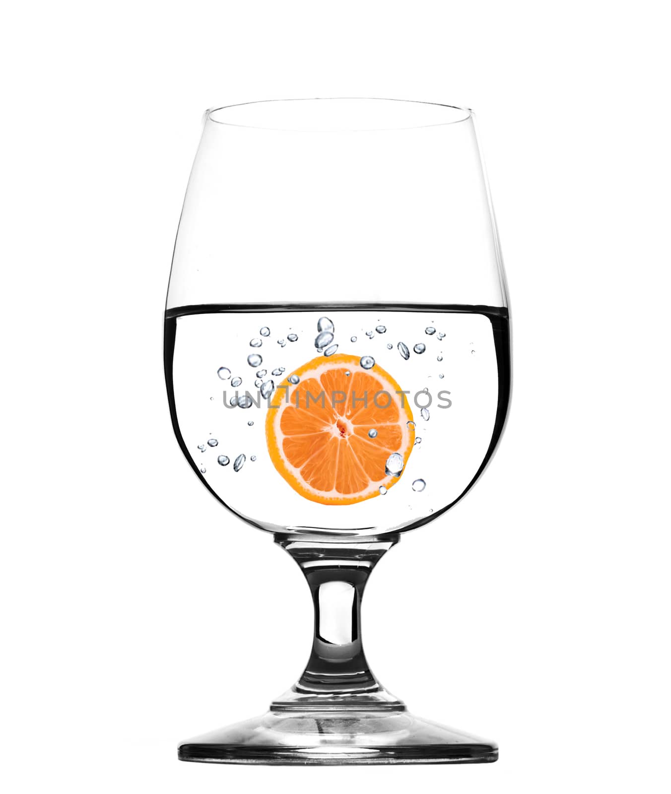 Glass of water with grapefruit -concept by ozaiachin