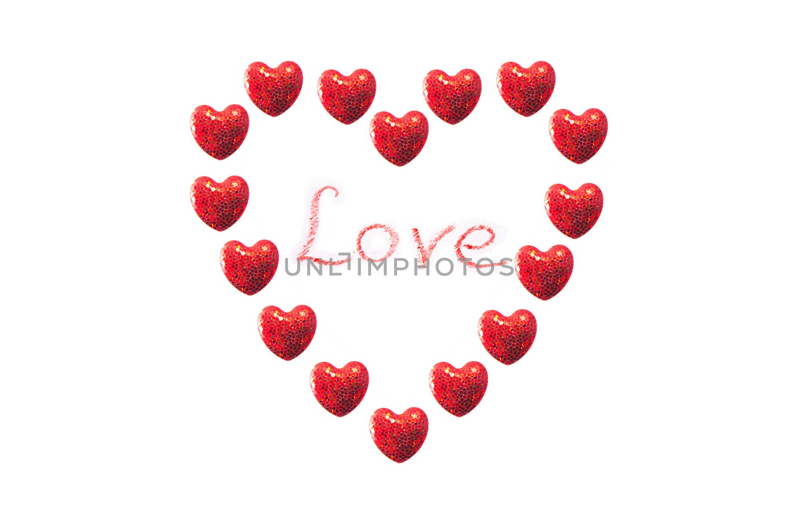 Valentine's day conceptual image. Hearts arranged in a heart shape with love inscription in the middle. 