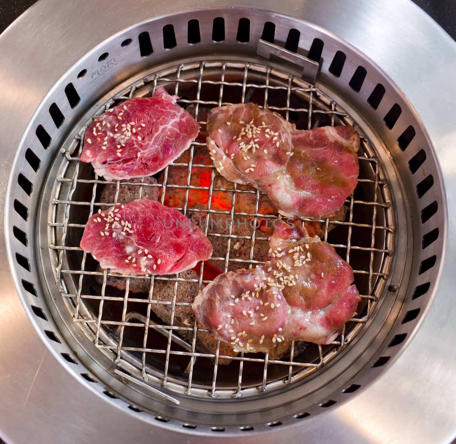 slide beef on the grill in japanese restaurant.