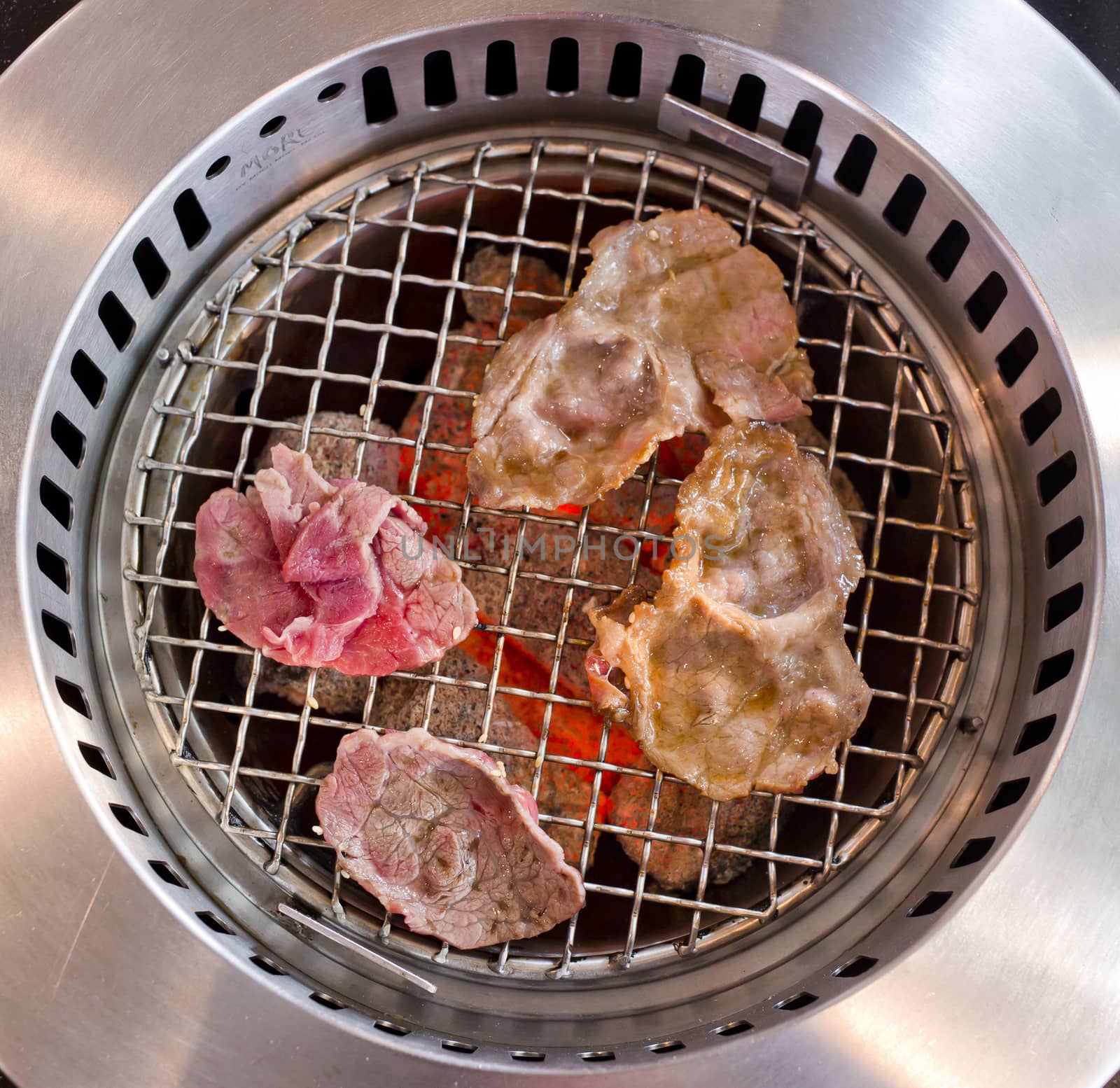 slide beef on the grill in japanese restaurant.