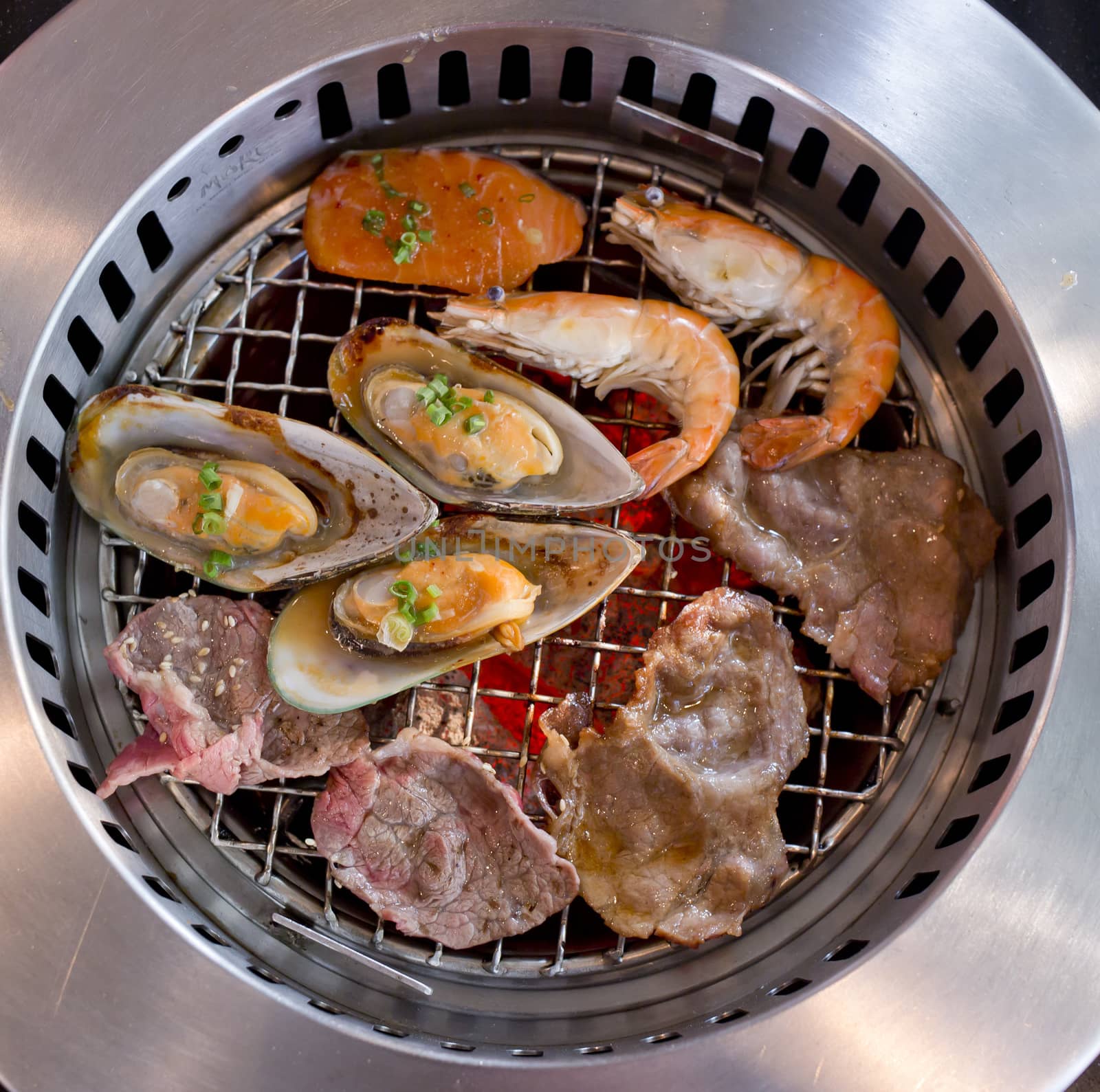 Mixed Roasted Meat and Seafood on the BBQ Grill on roast.