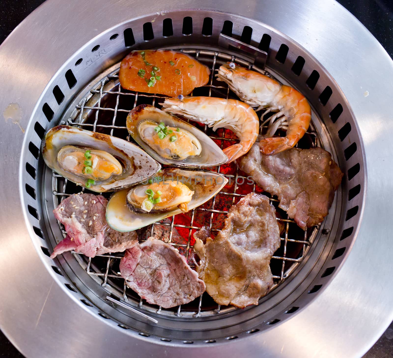 Mixed Roasted Meat and Seafood on the BBQ Grill on roast.