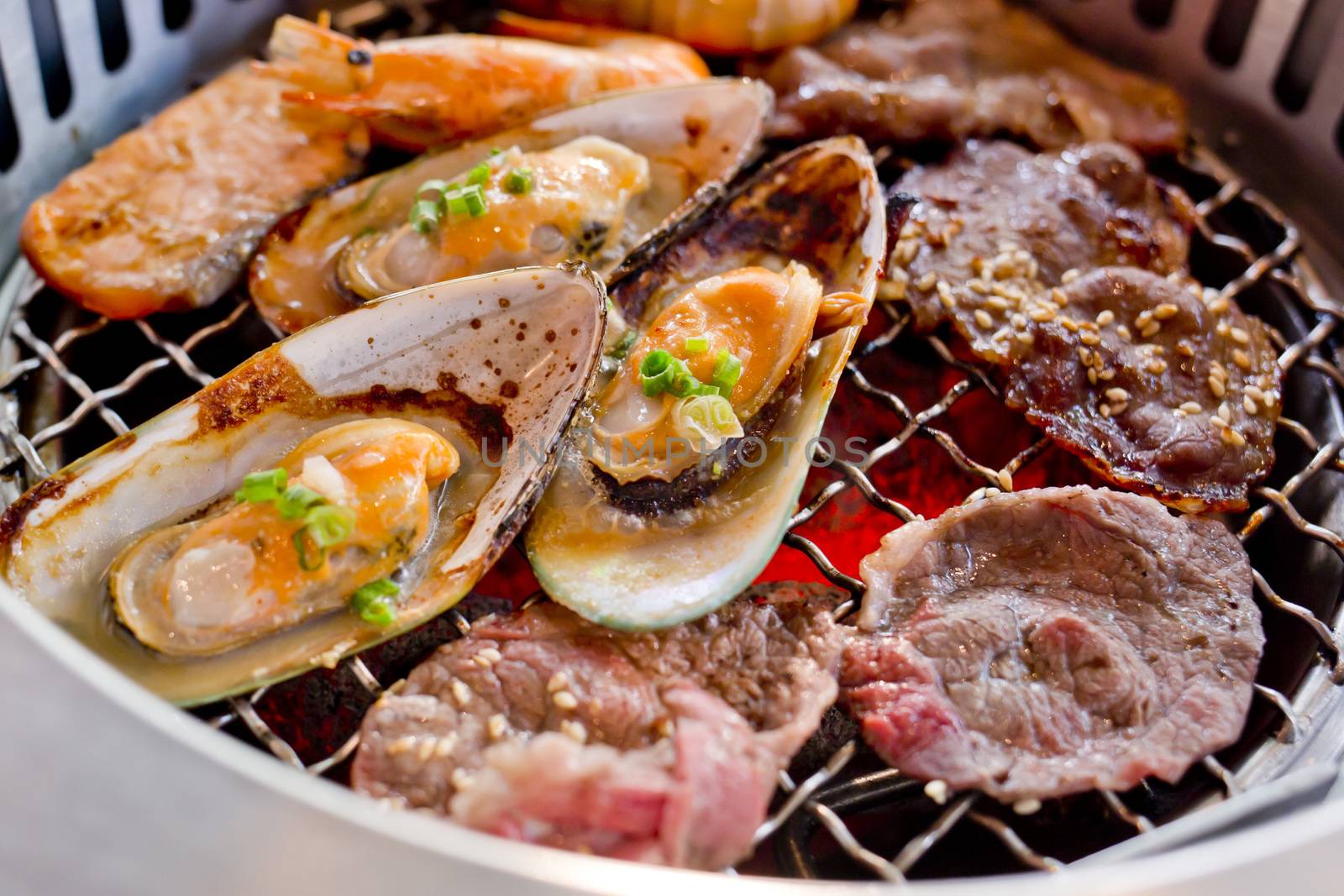 Mixed Roasted Meat and Seafood on the BBQ Grill on roast.