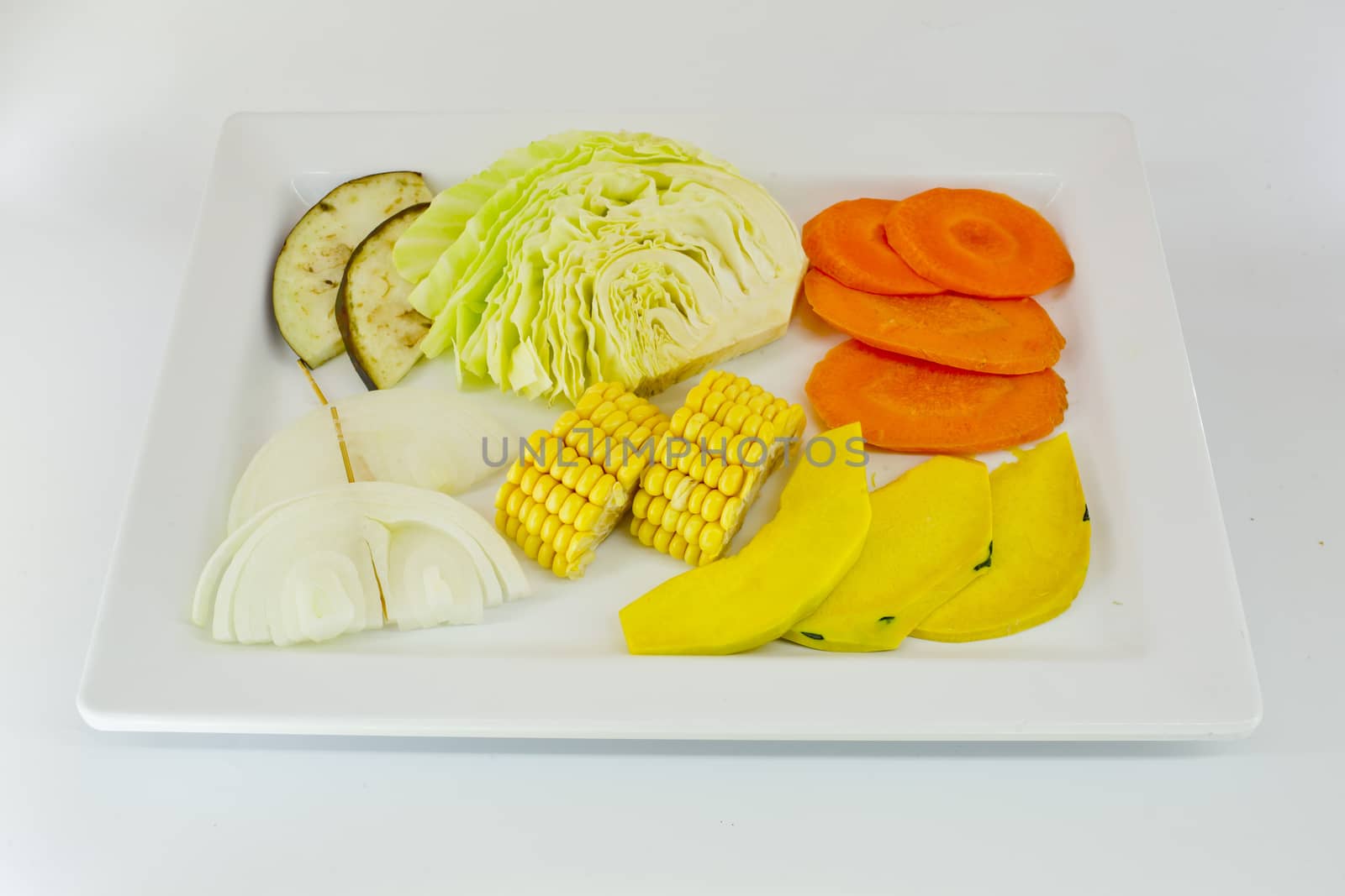 Slice Mixed vegetables  on white dish isolate