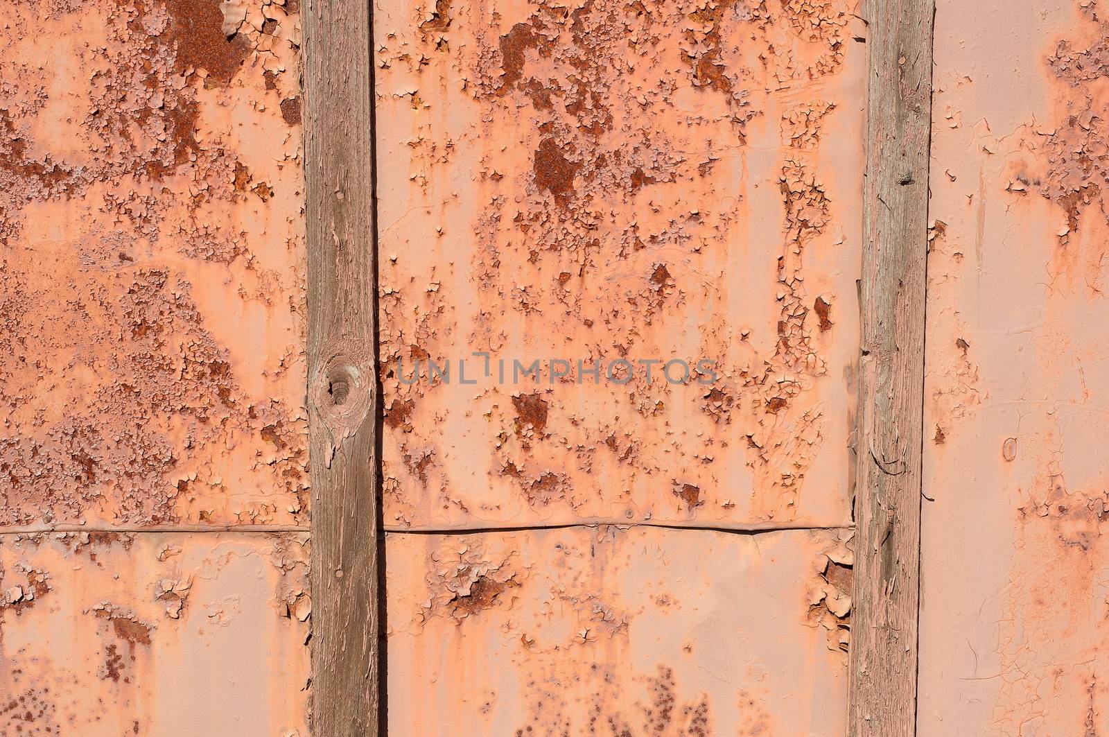 Old Rusty Iron Fence with Peeling Paint and Boards