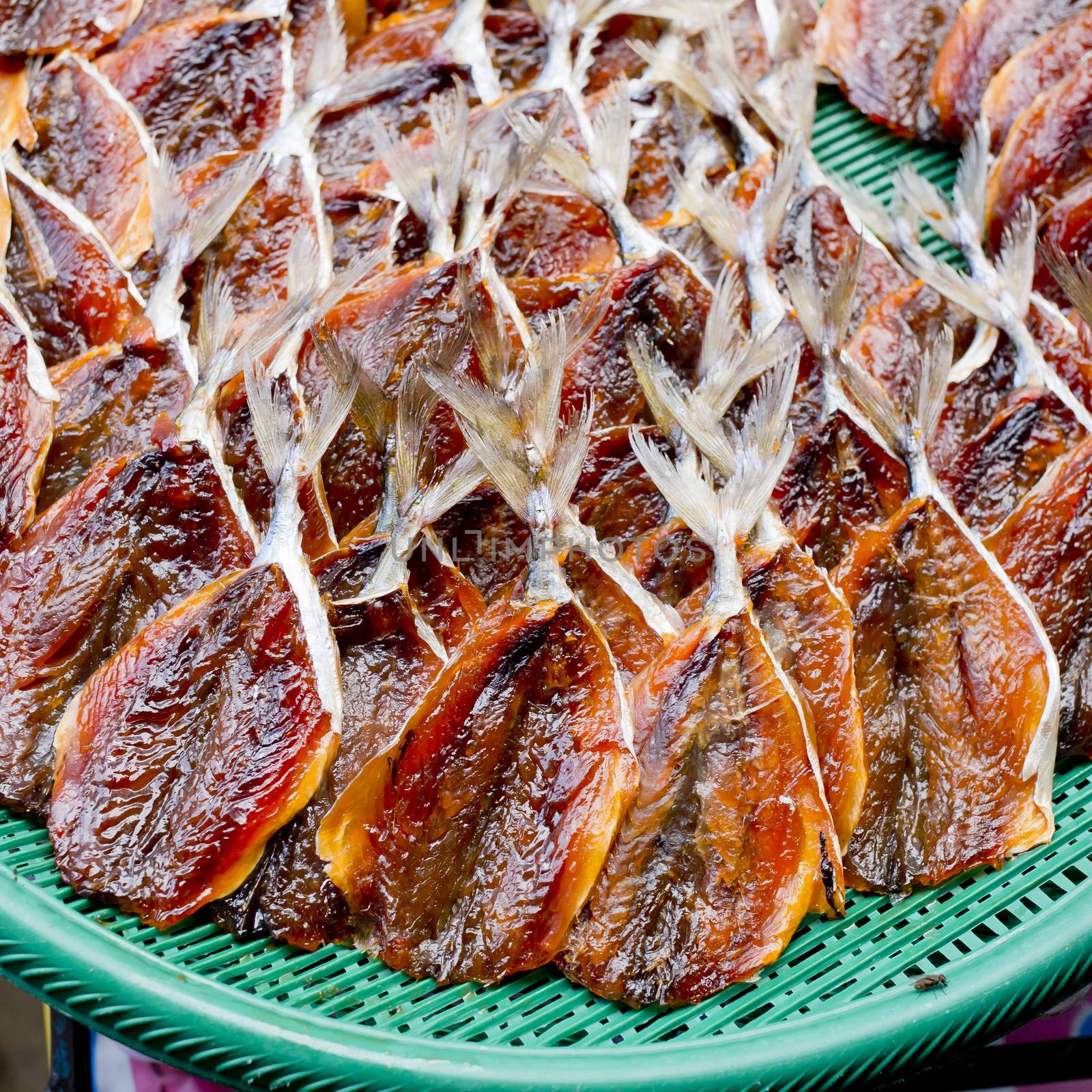 Dried fishes in the green basket