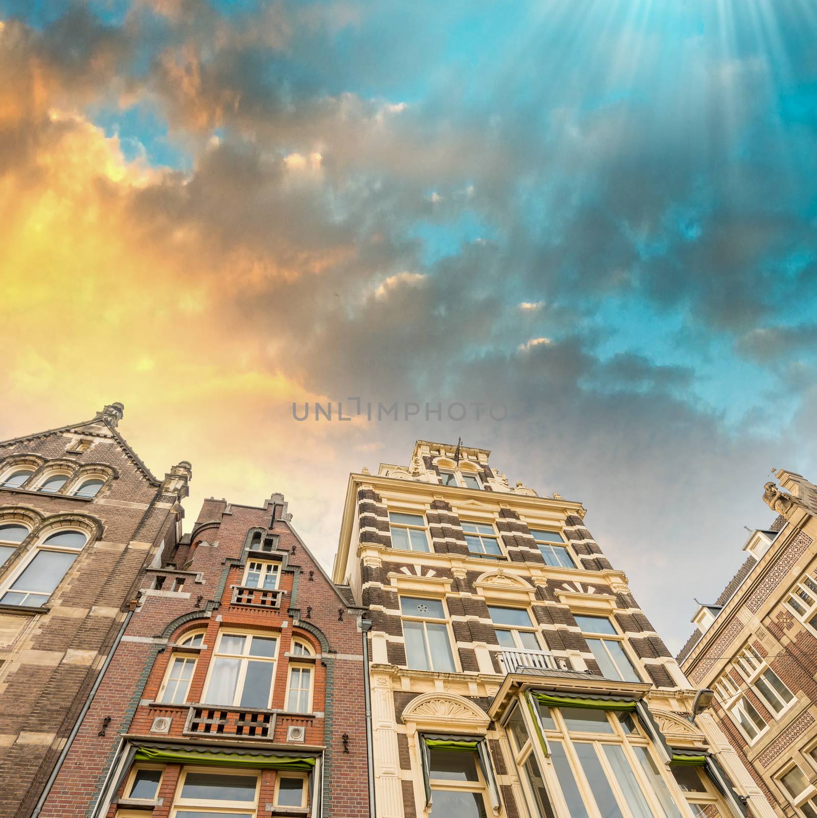 Dramatic sky over Amsterdam buildings.